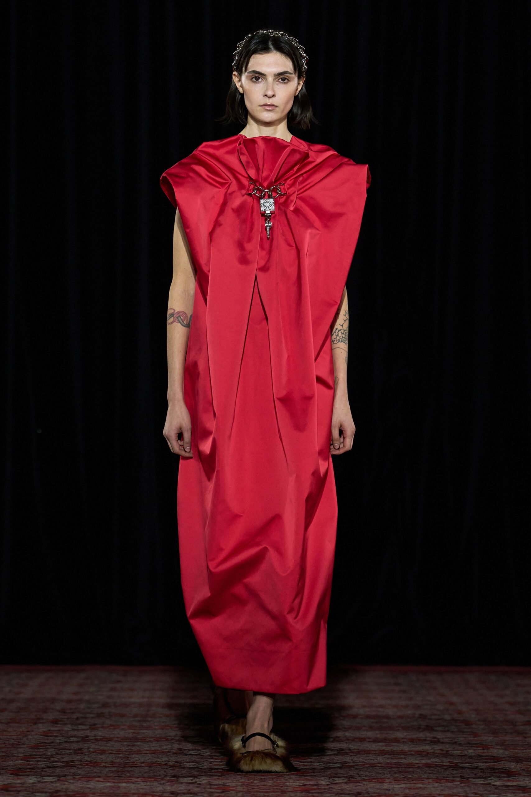 red silk sleeveless high-neck relaxed pleated draped gown