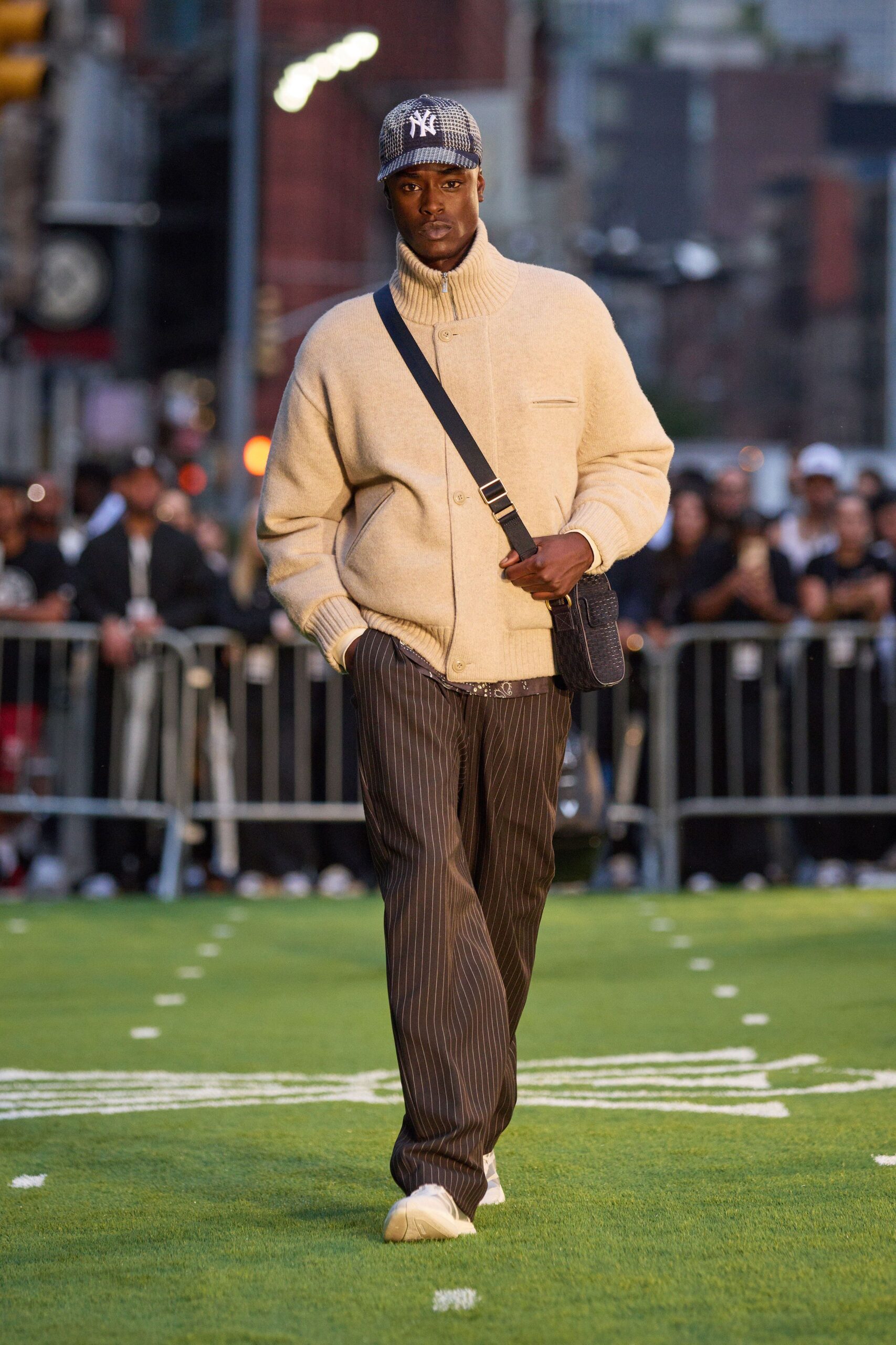 beige wool relaxed sweater with striped pants