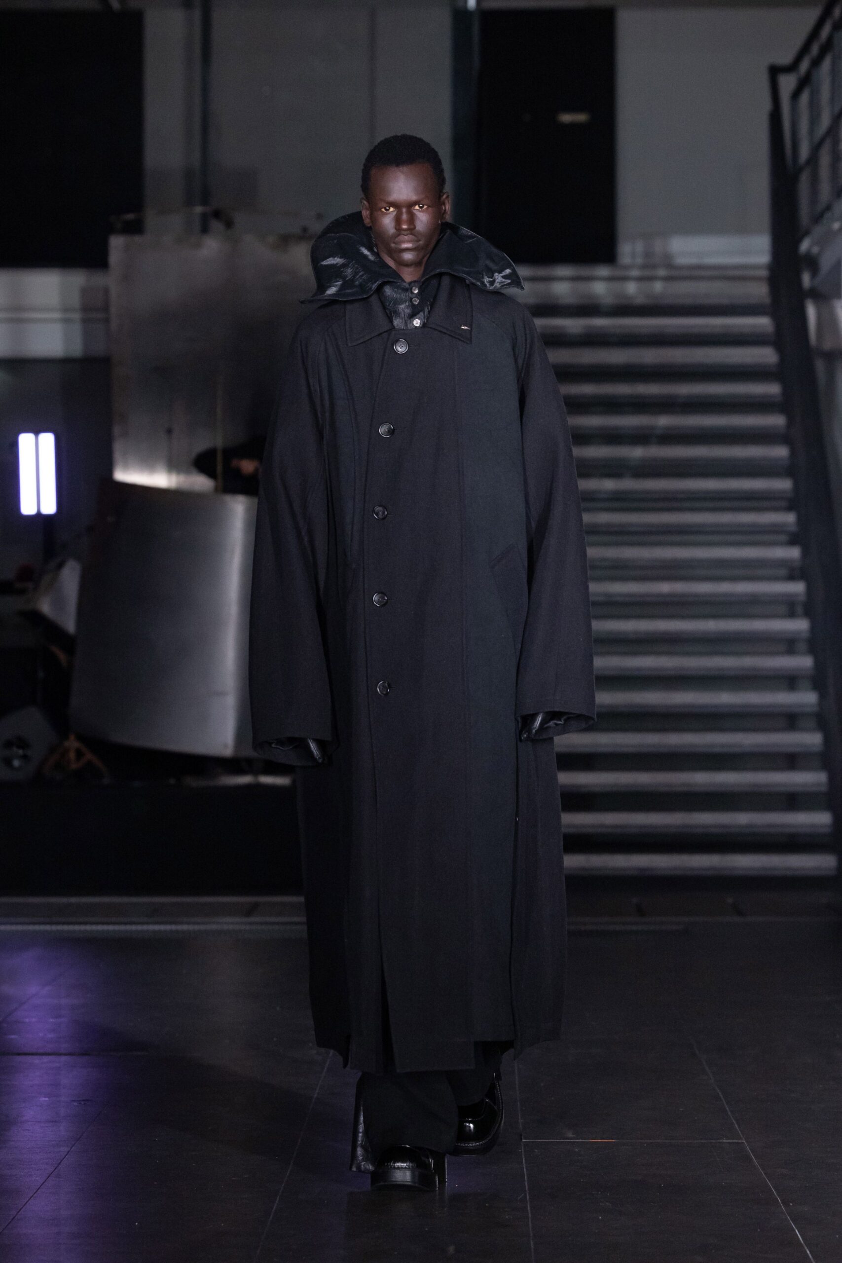 black wool long-sleeve collared oversized buttoned coat