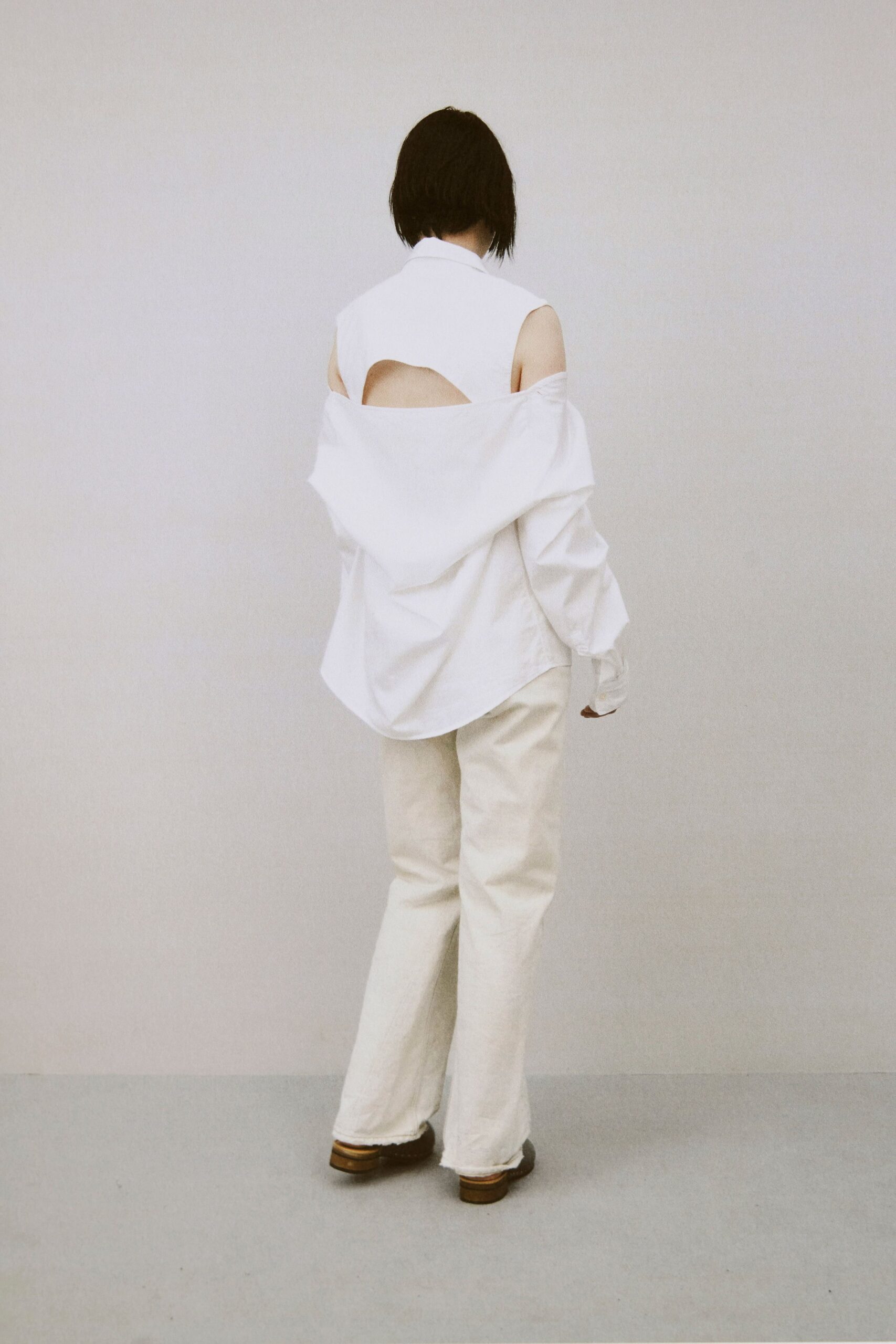 white relaxed shirt beige flared pants