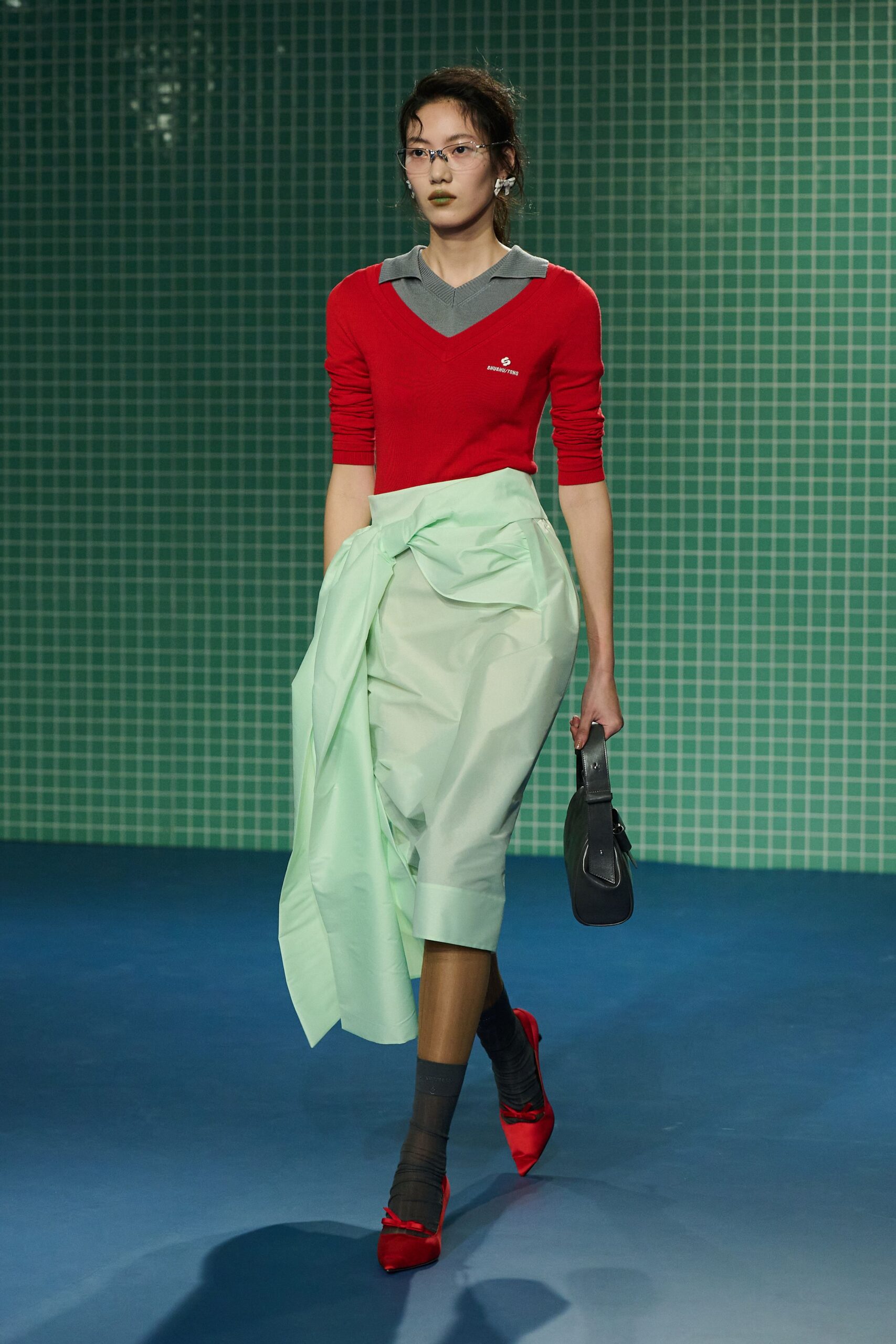 red fitted top with green skirt