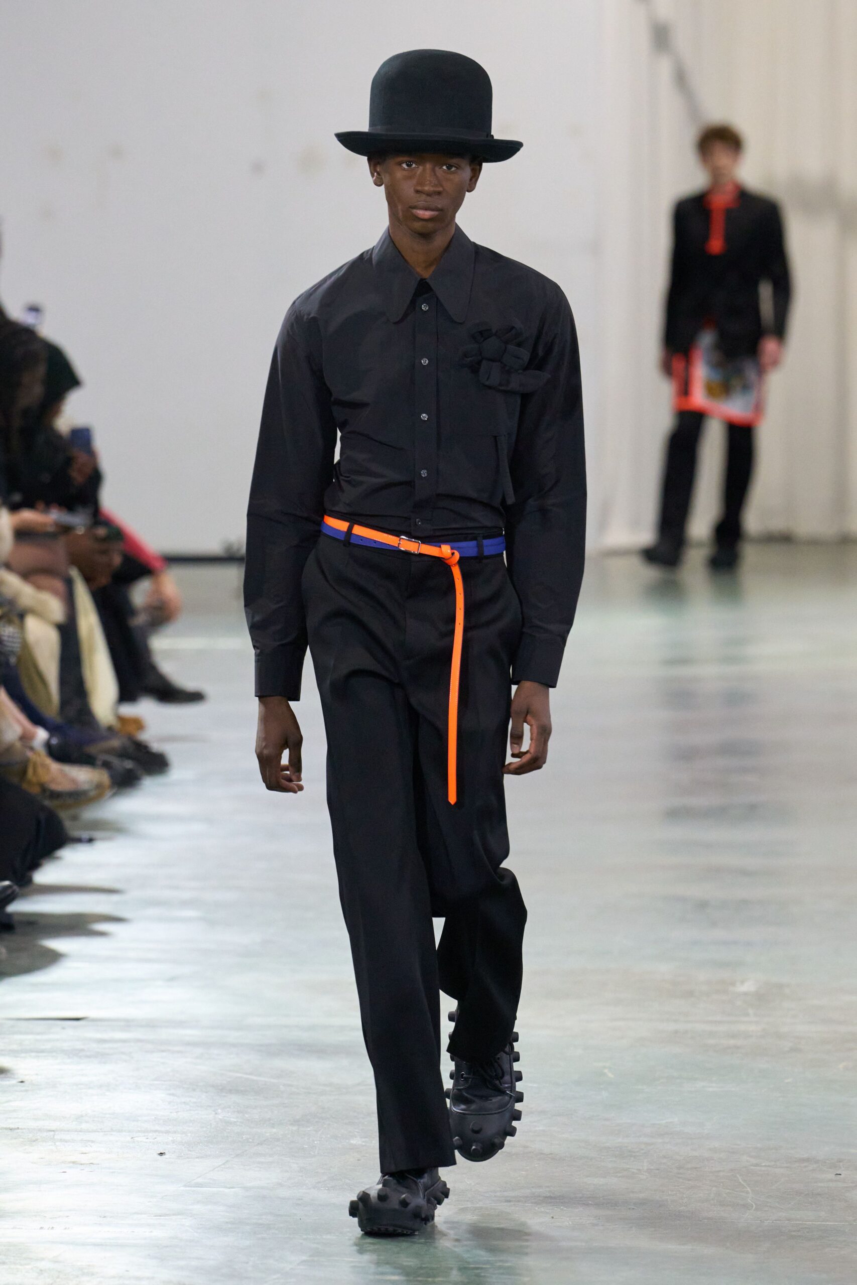 black shirt and pants with hat