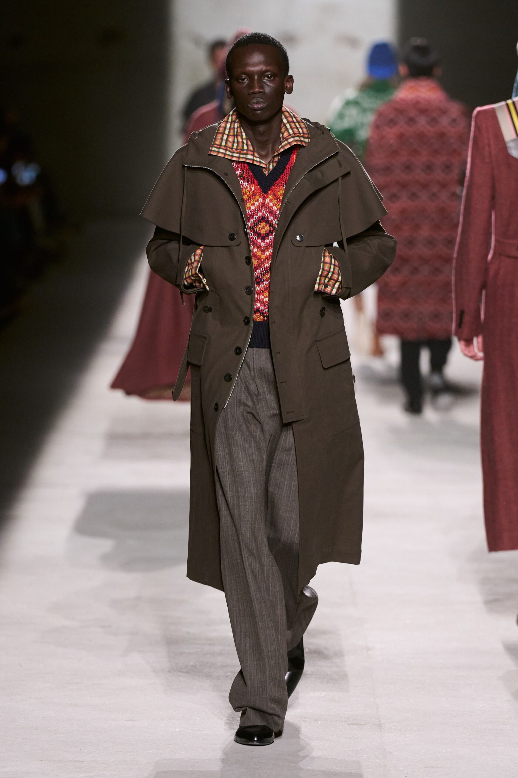 brown coat with red sweater