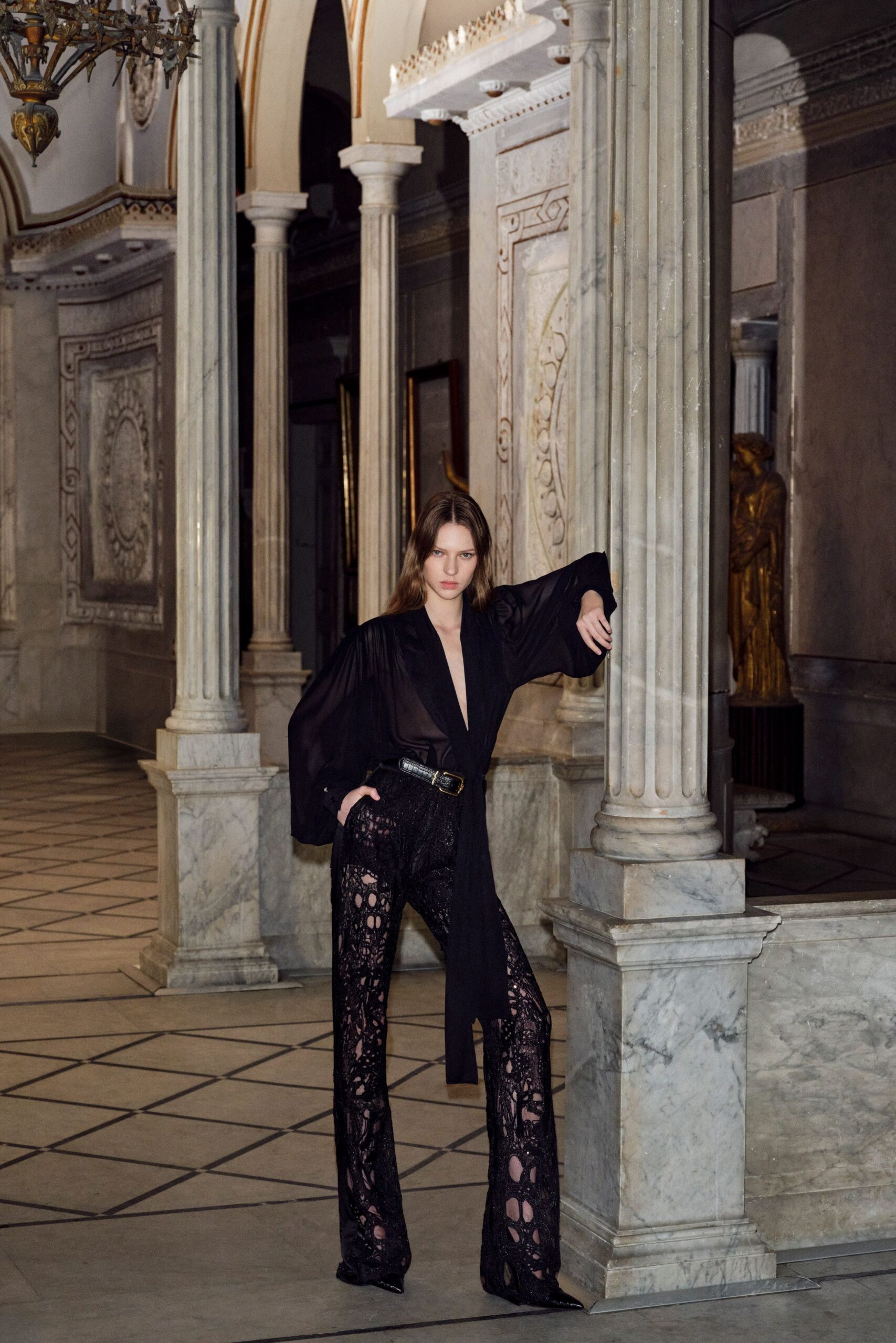 black sheer top with flared pants