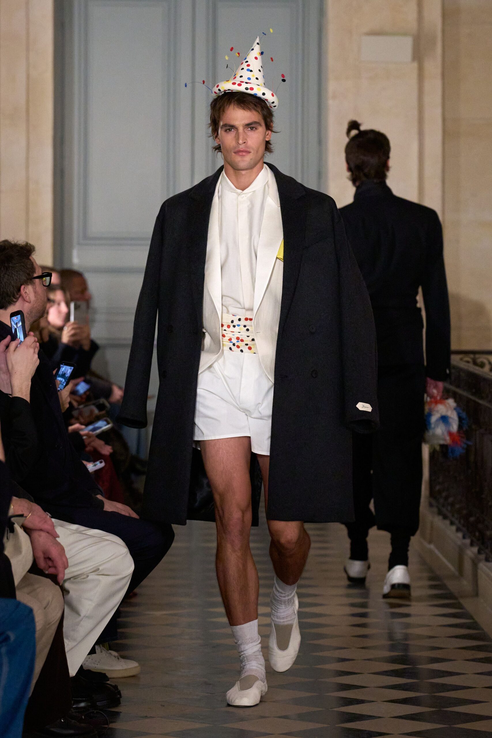 black oversized coat white shirt shorts