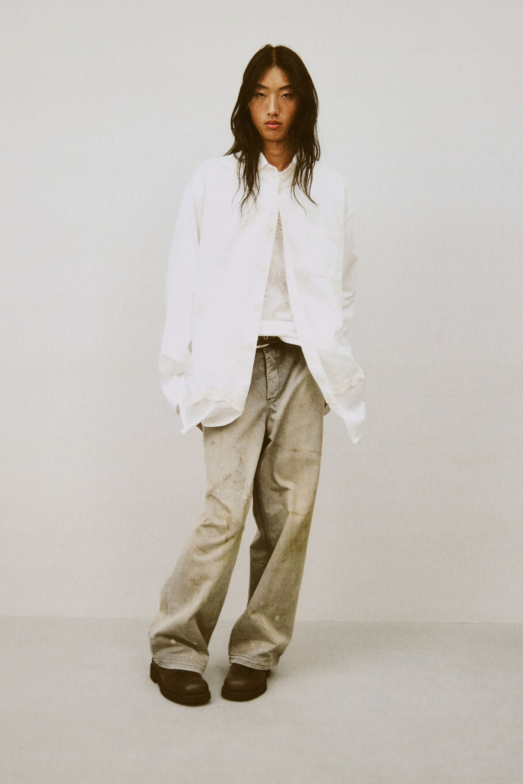 white relaxed shirt gray pants