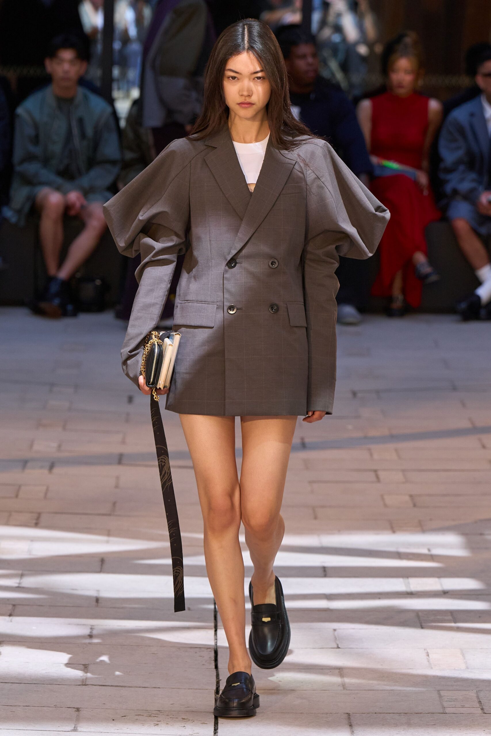 gray tailored blazer with black shorts