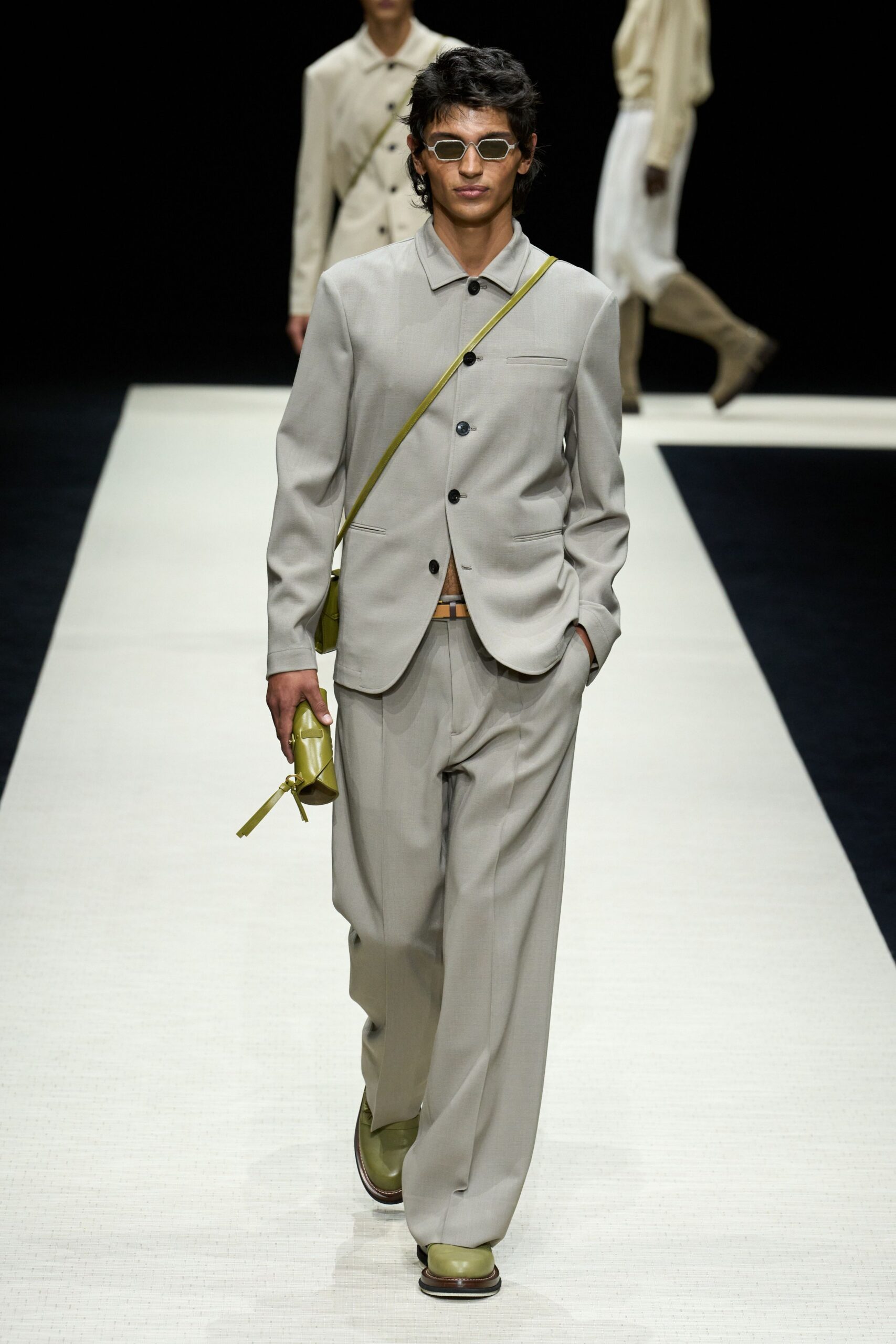 beige relaxed suit with green accessories