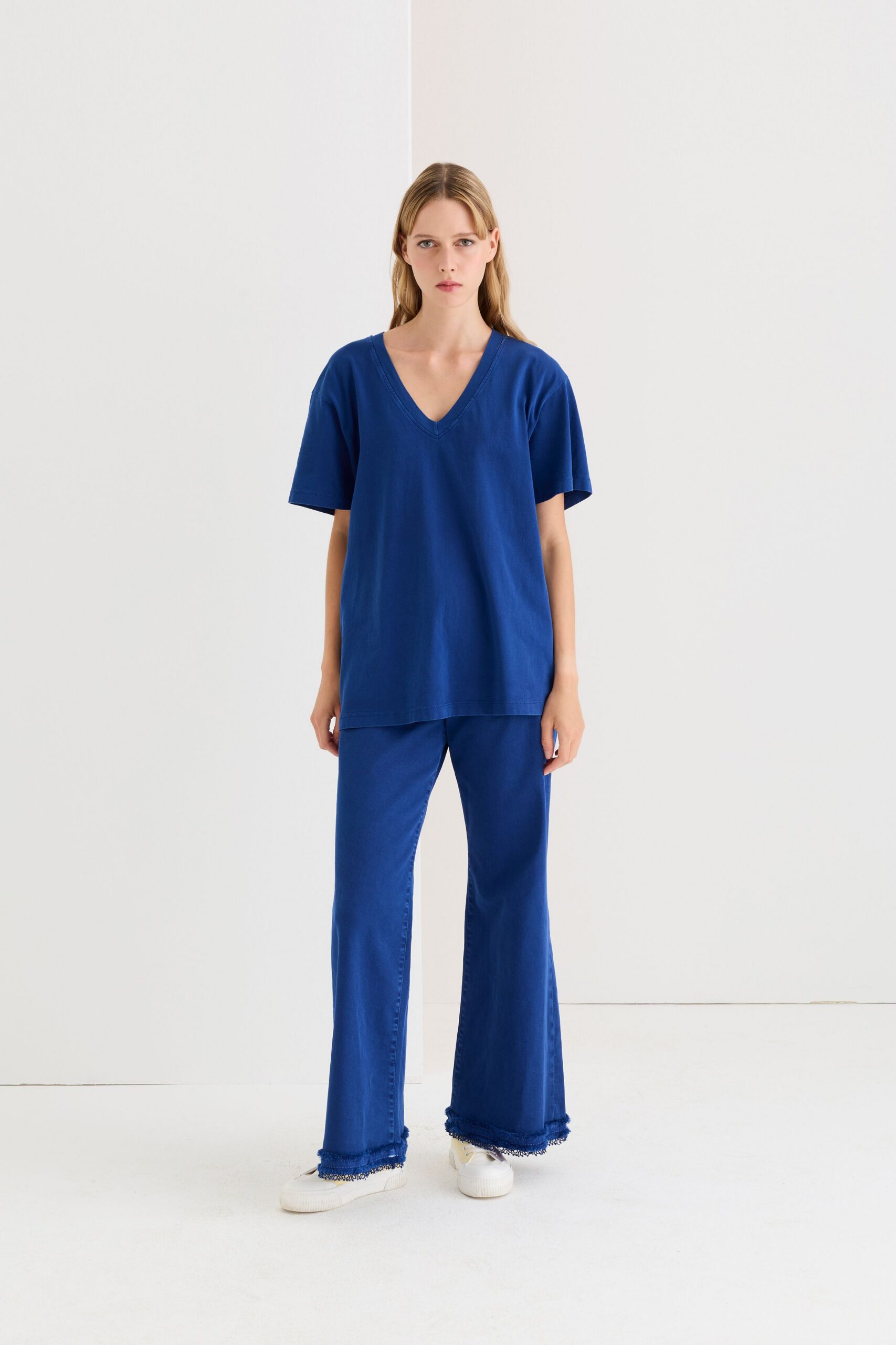 blue relaxed top with flared pants