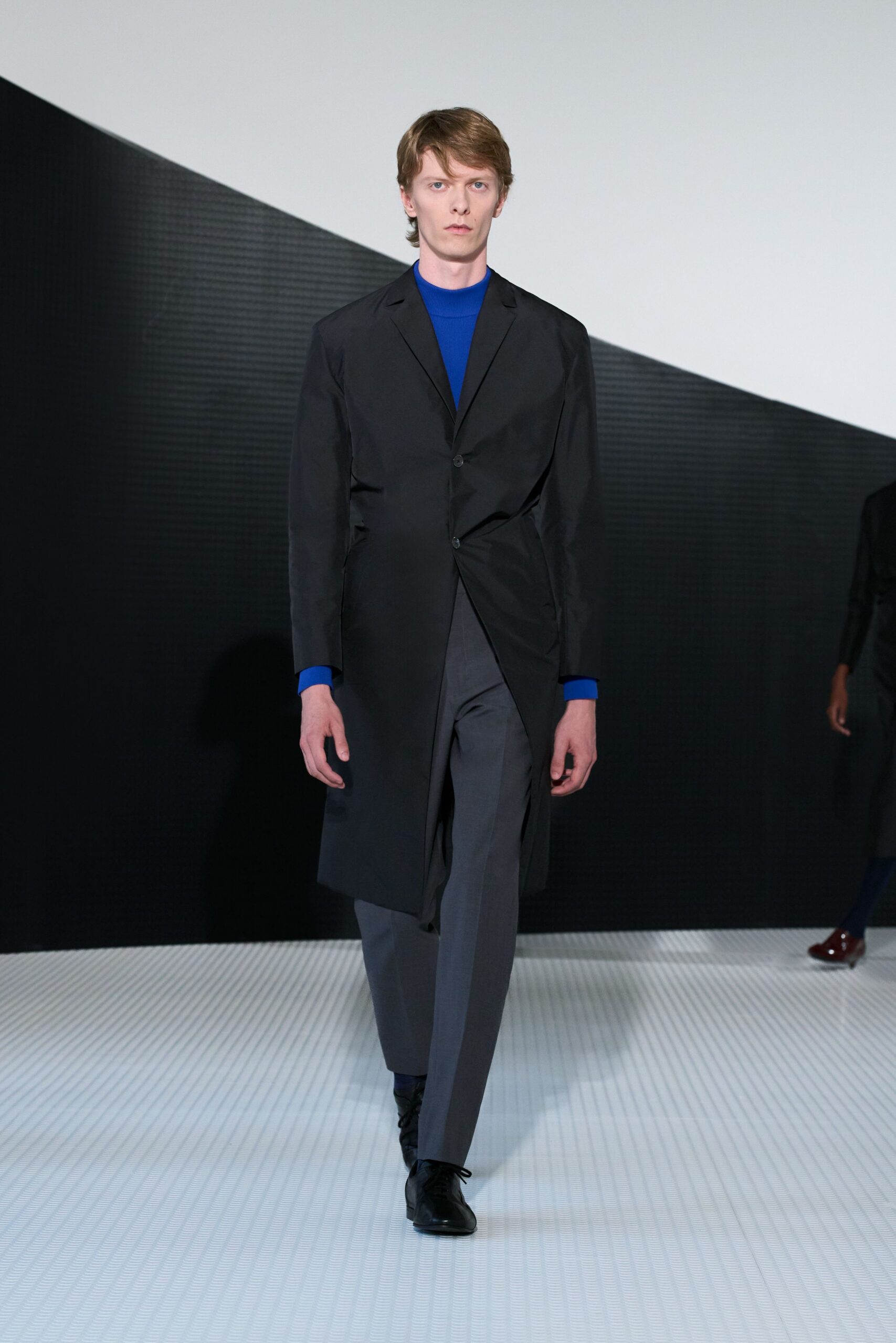 black cotton long-sleeve collared structured buttoned coat