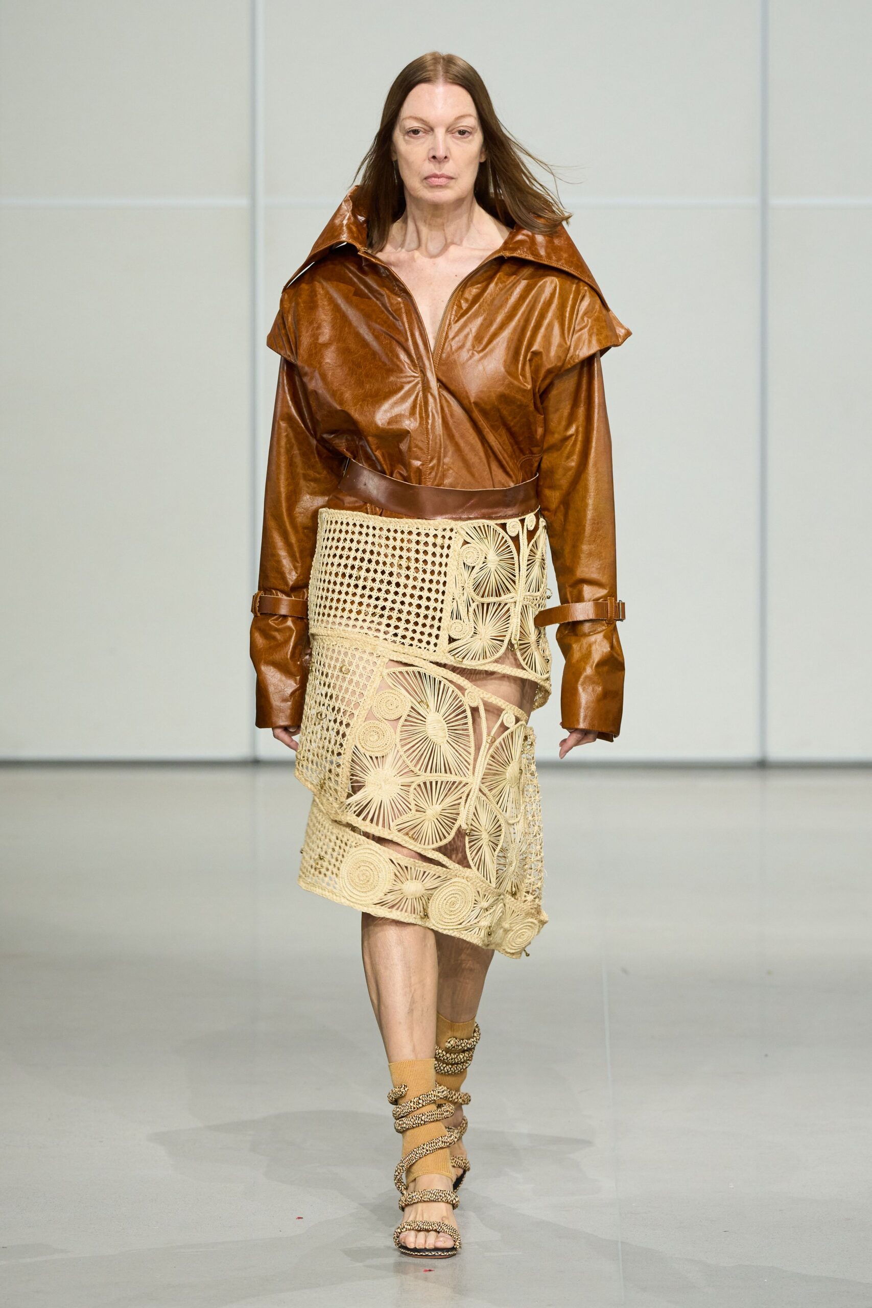brown leather jacket beige embroidered skirt