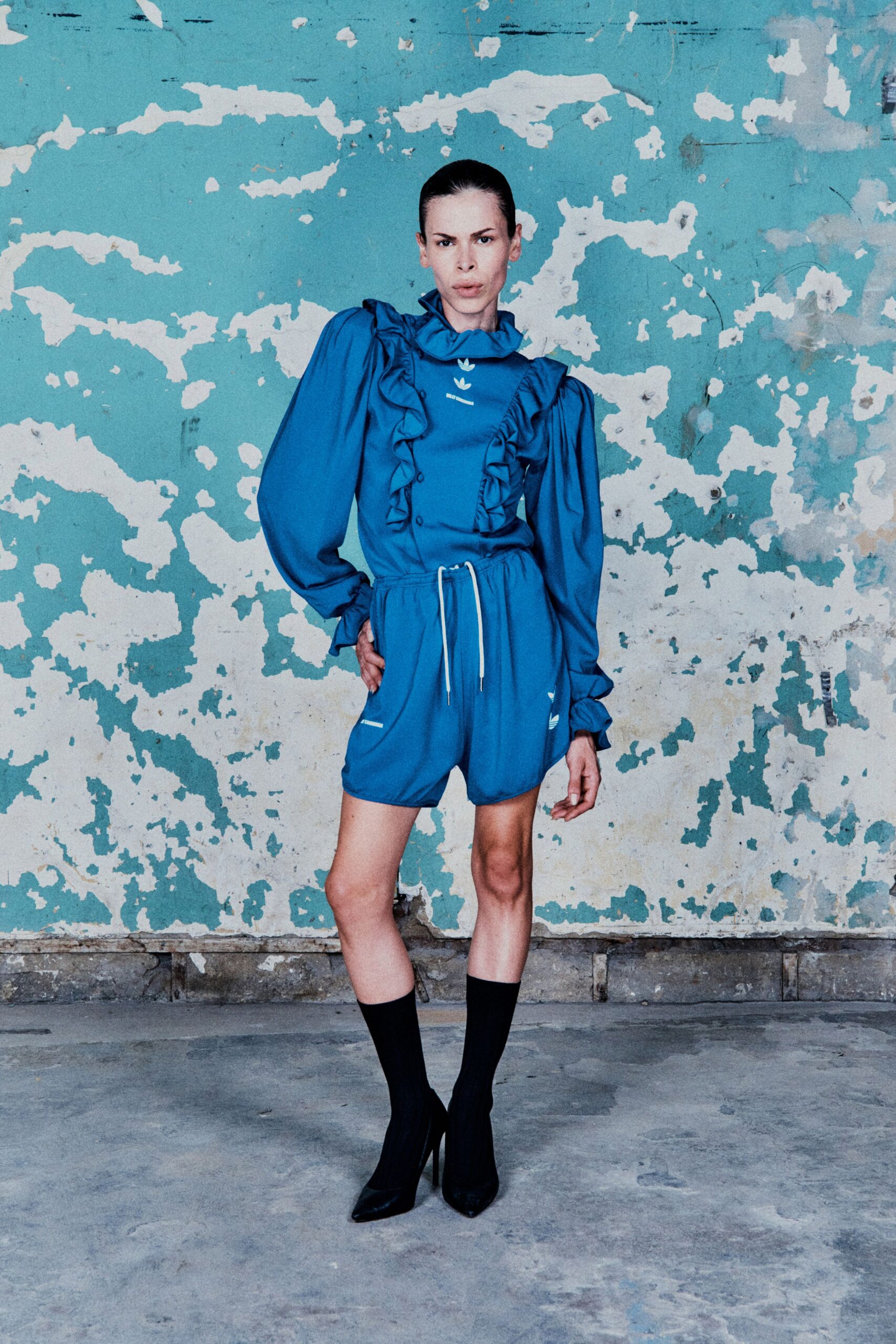 blue cotton long-sleeve high-neck fitted ruffled top
