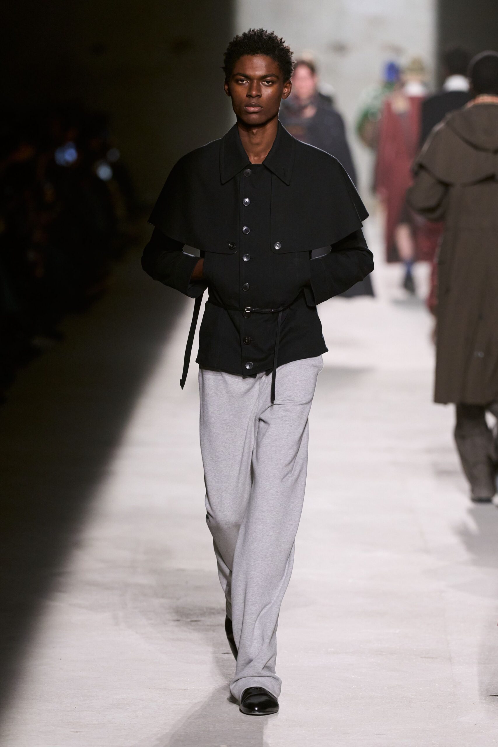 black fitted jacket gray pants