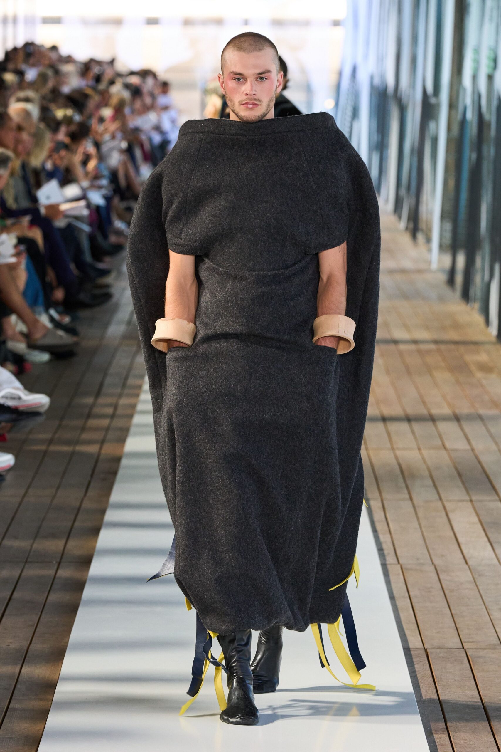 black wool oversized cape with relaxed pants