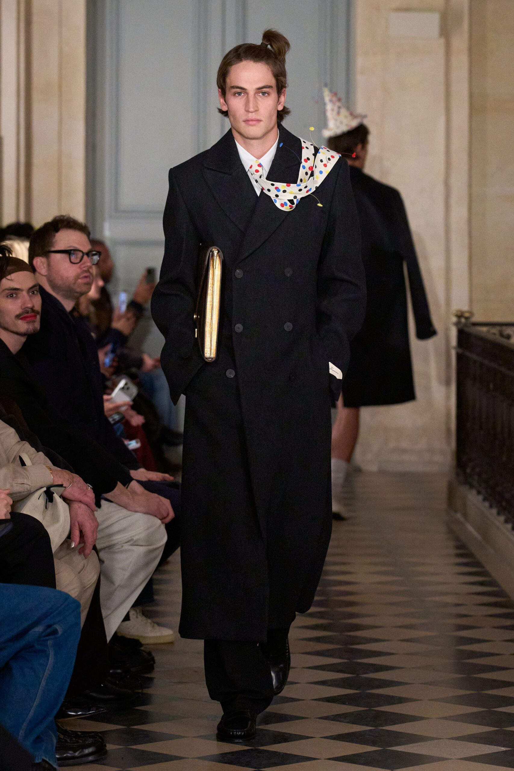 black wool coat with gold bag
