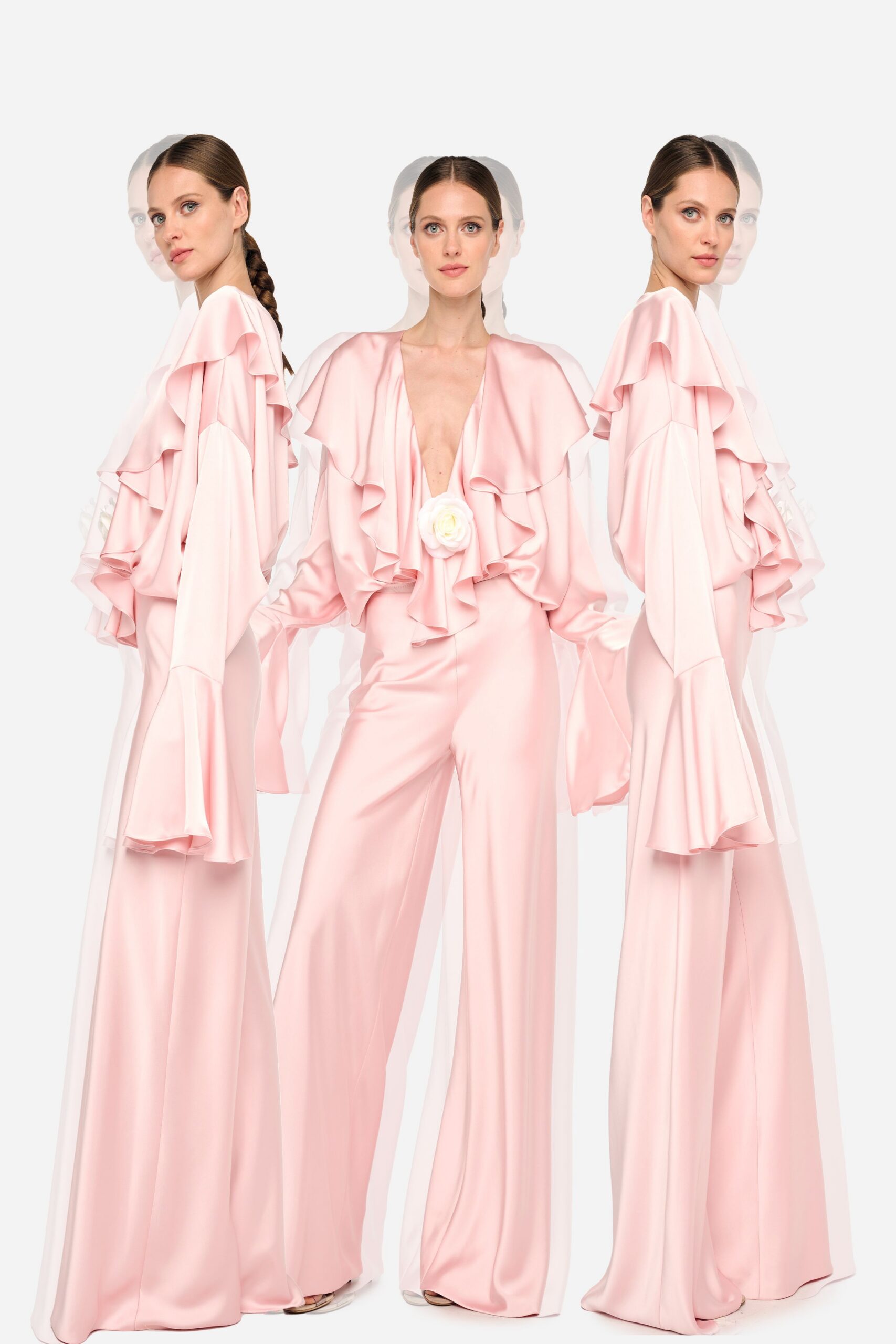 pink ruffled jumpsuit with nude shoes