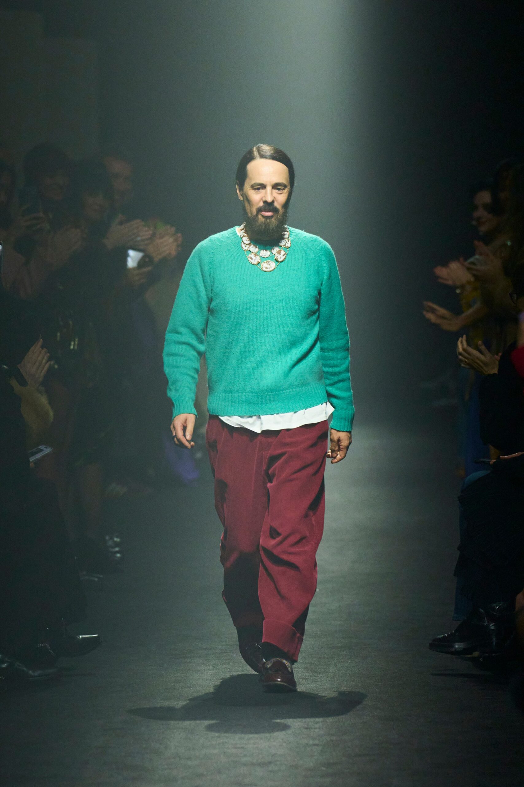 green wool sweater with red pants