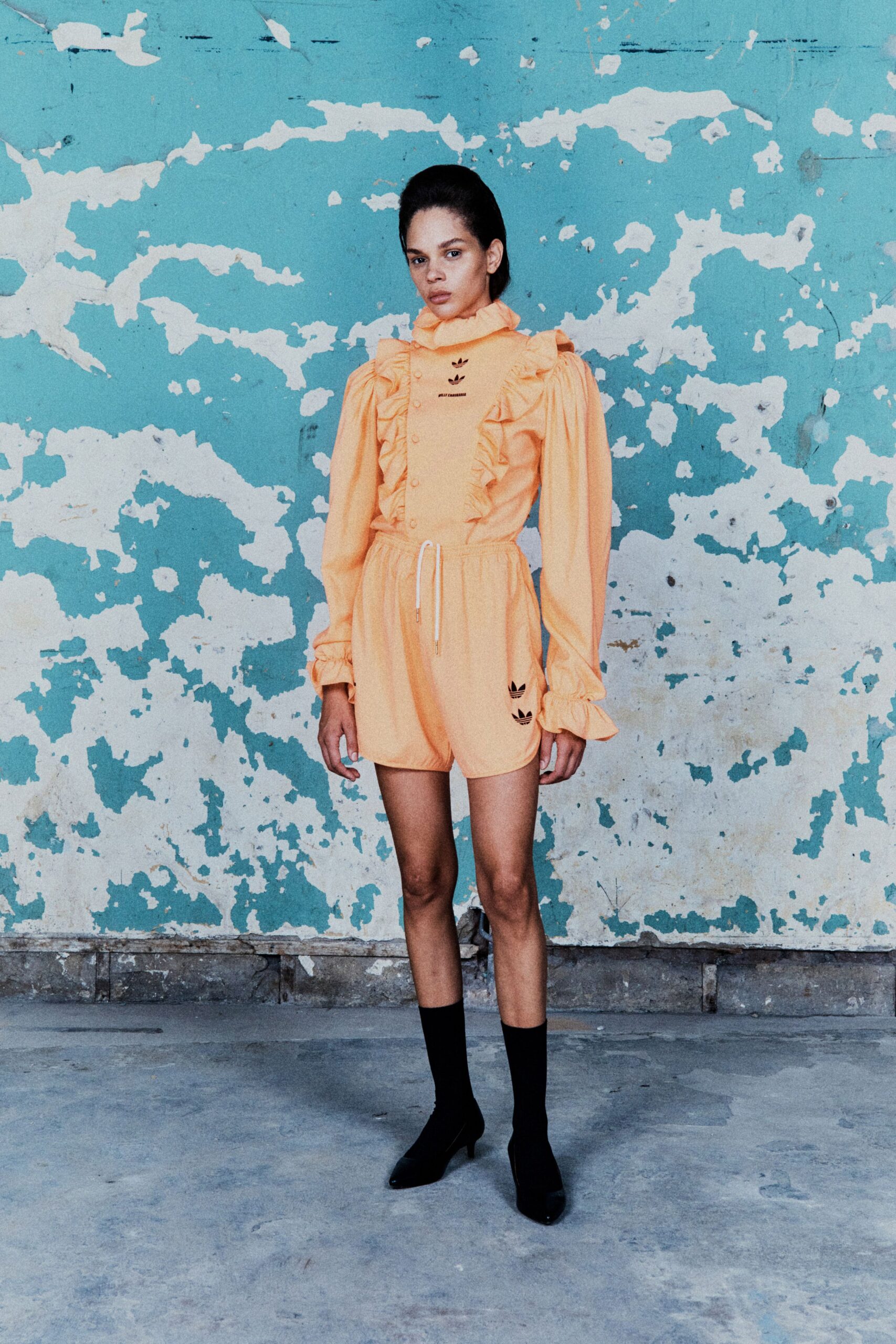 orange cotton long-sleeve collared fitted ruffled romper