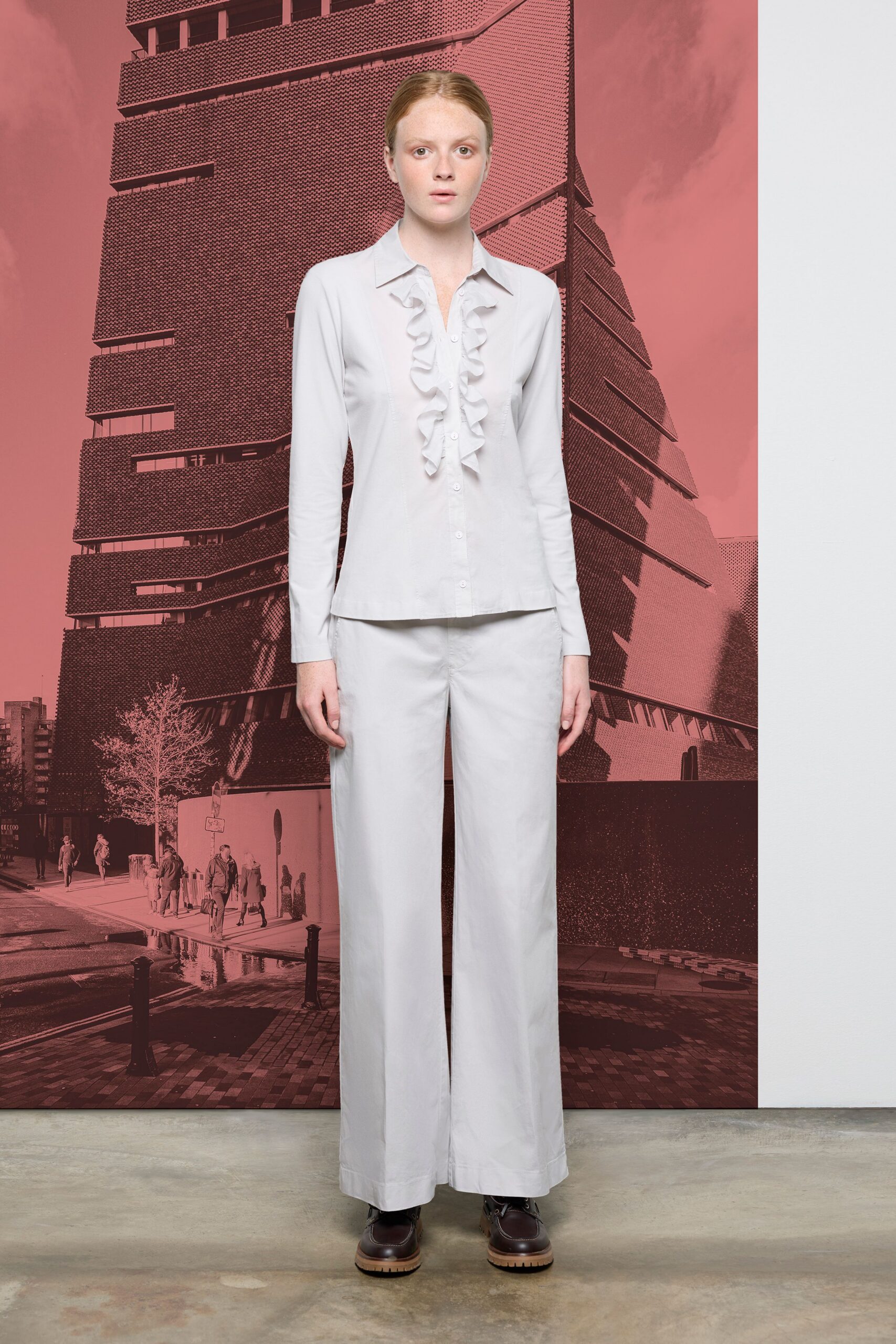 white ruffled shirt and wide-leg pants