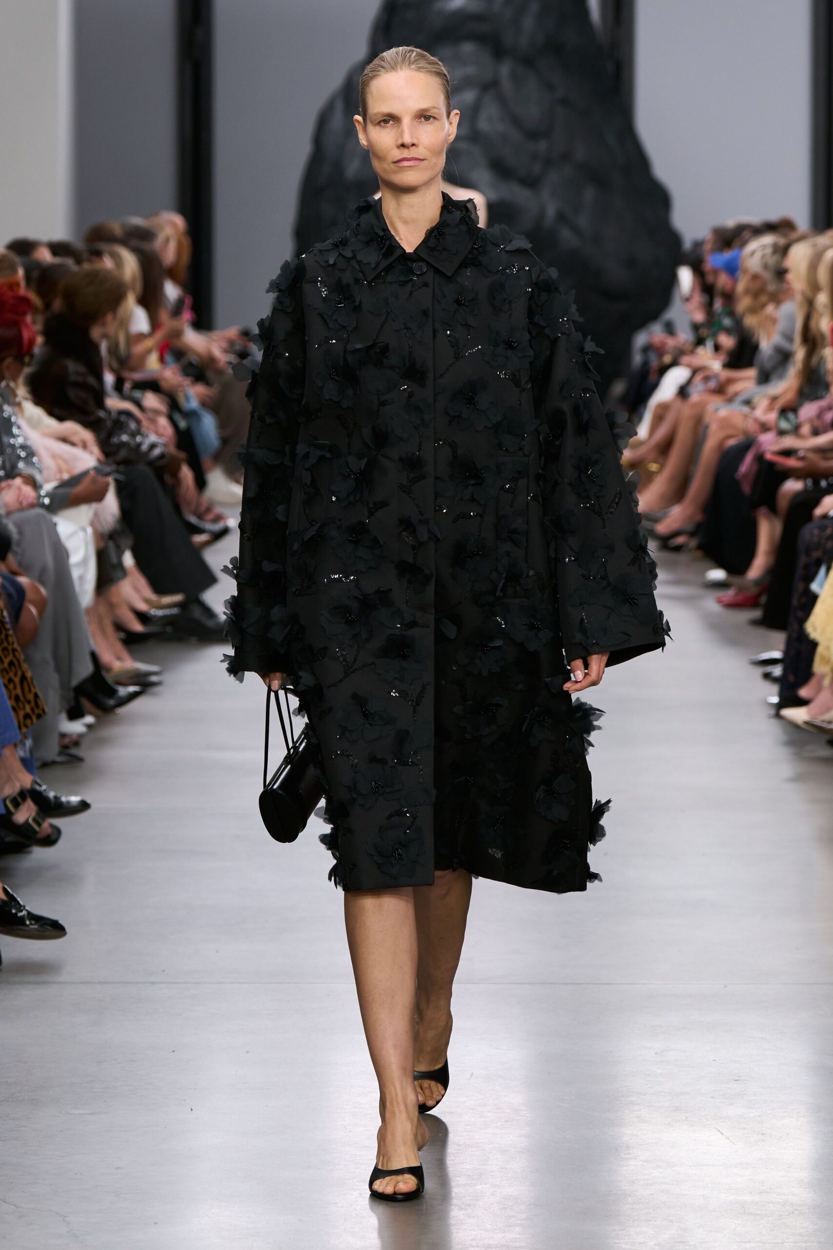 black embroidered coat with shoes and bag