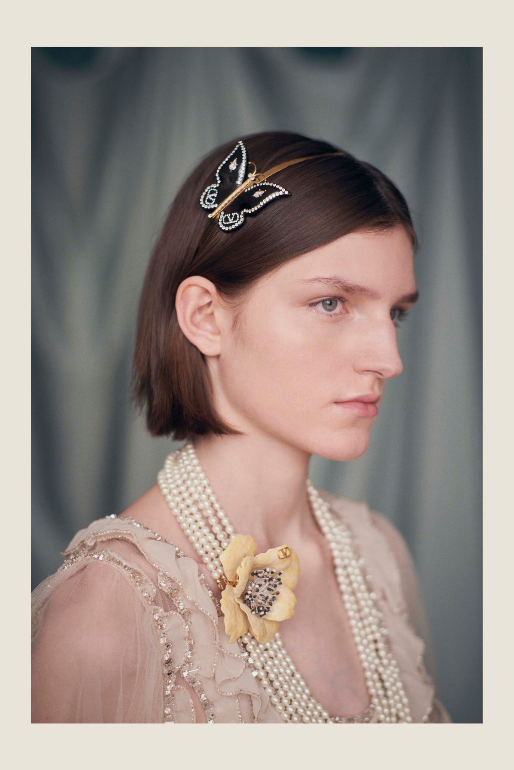 beige embroidered gown with accessories