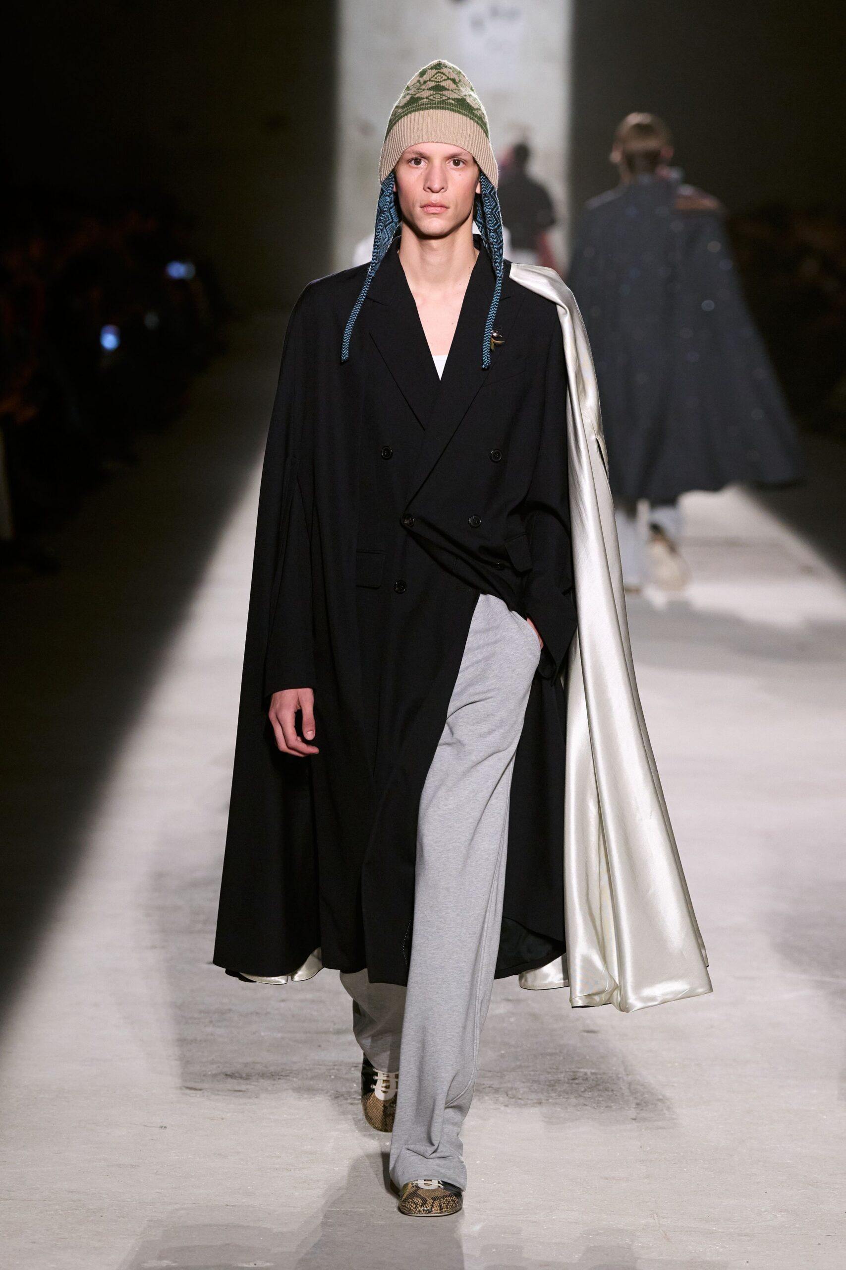 black cape white jacket gray pants