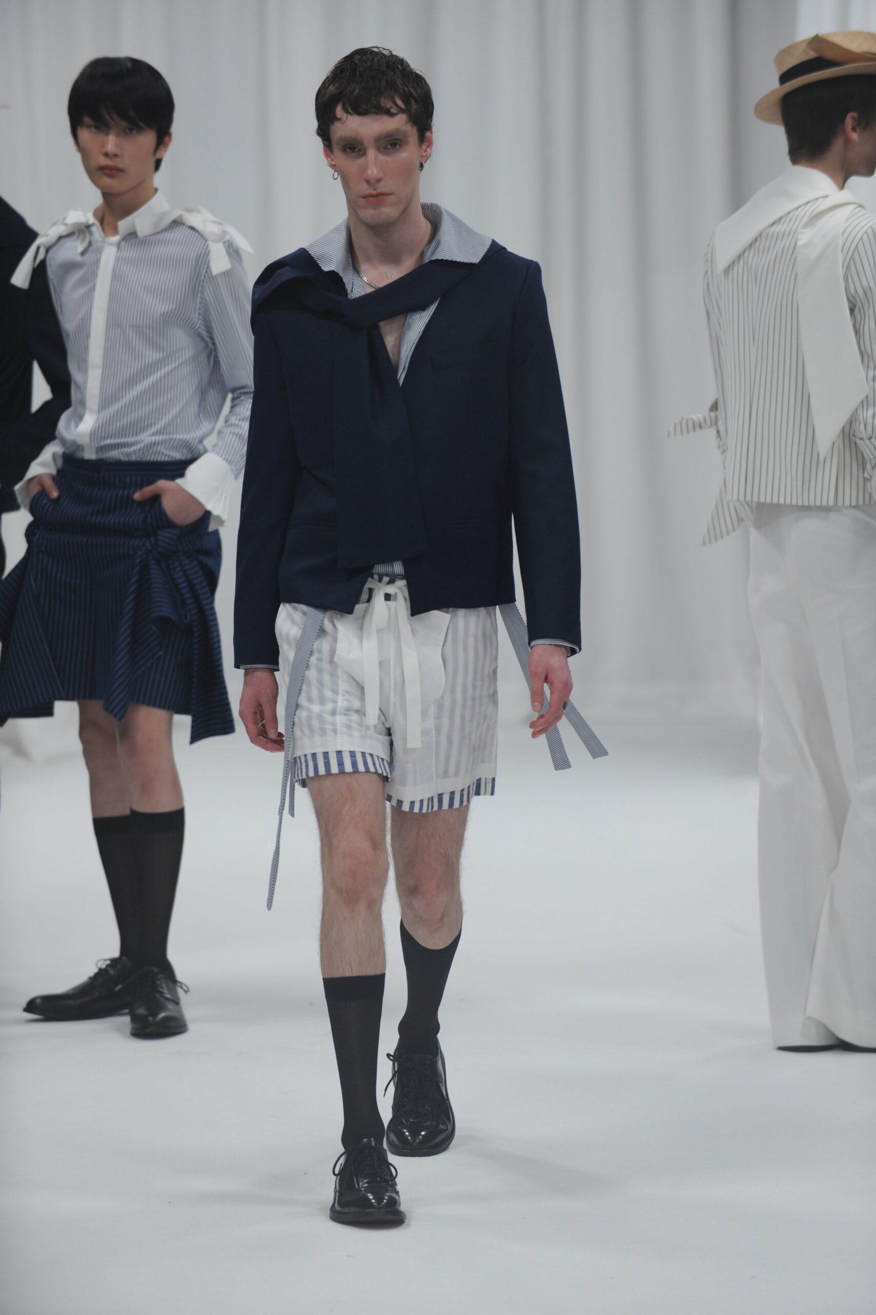 navy jacket with striped shorts