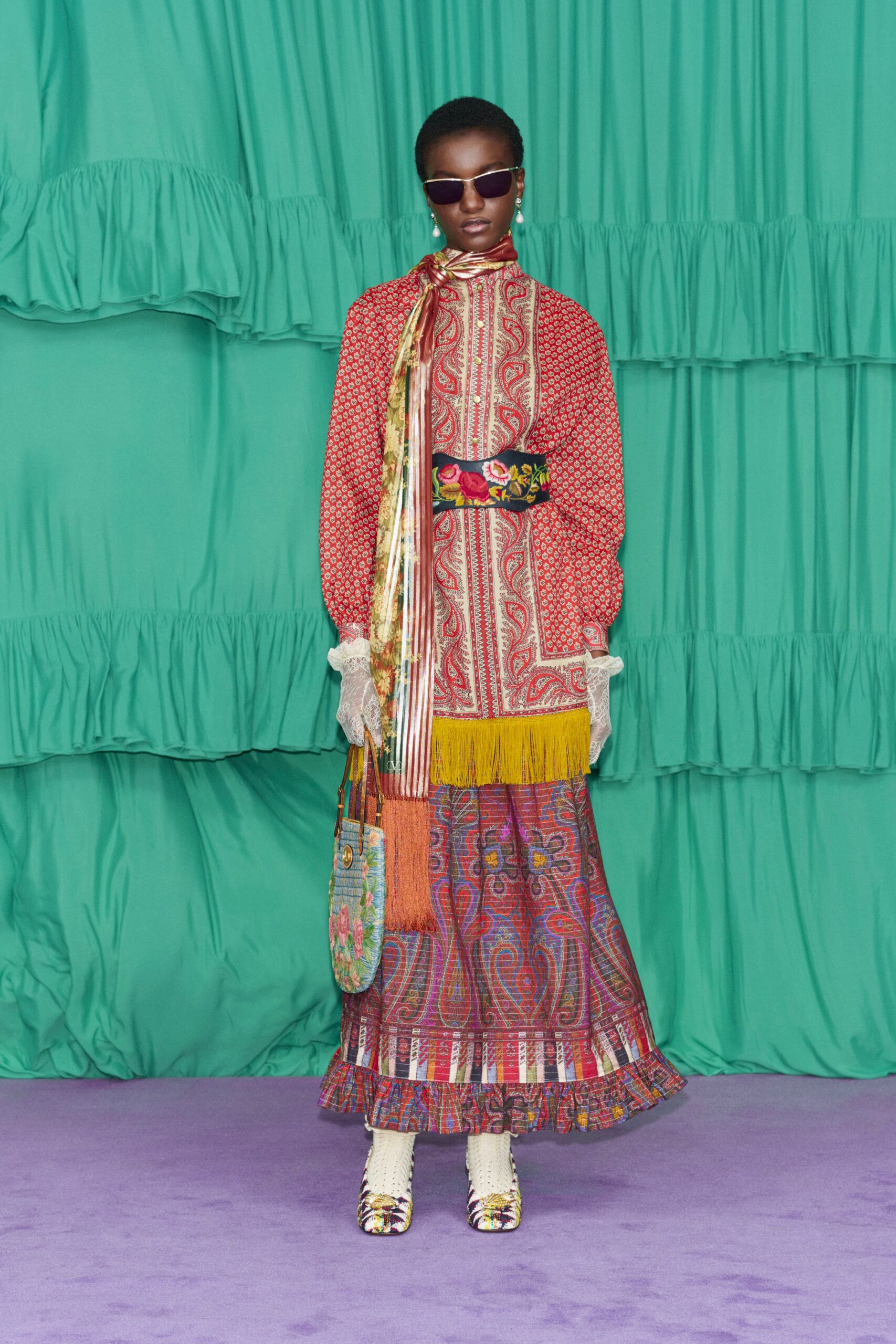 red cotton long-sleeve fitted pleated fringed maxi dress