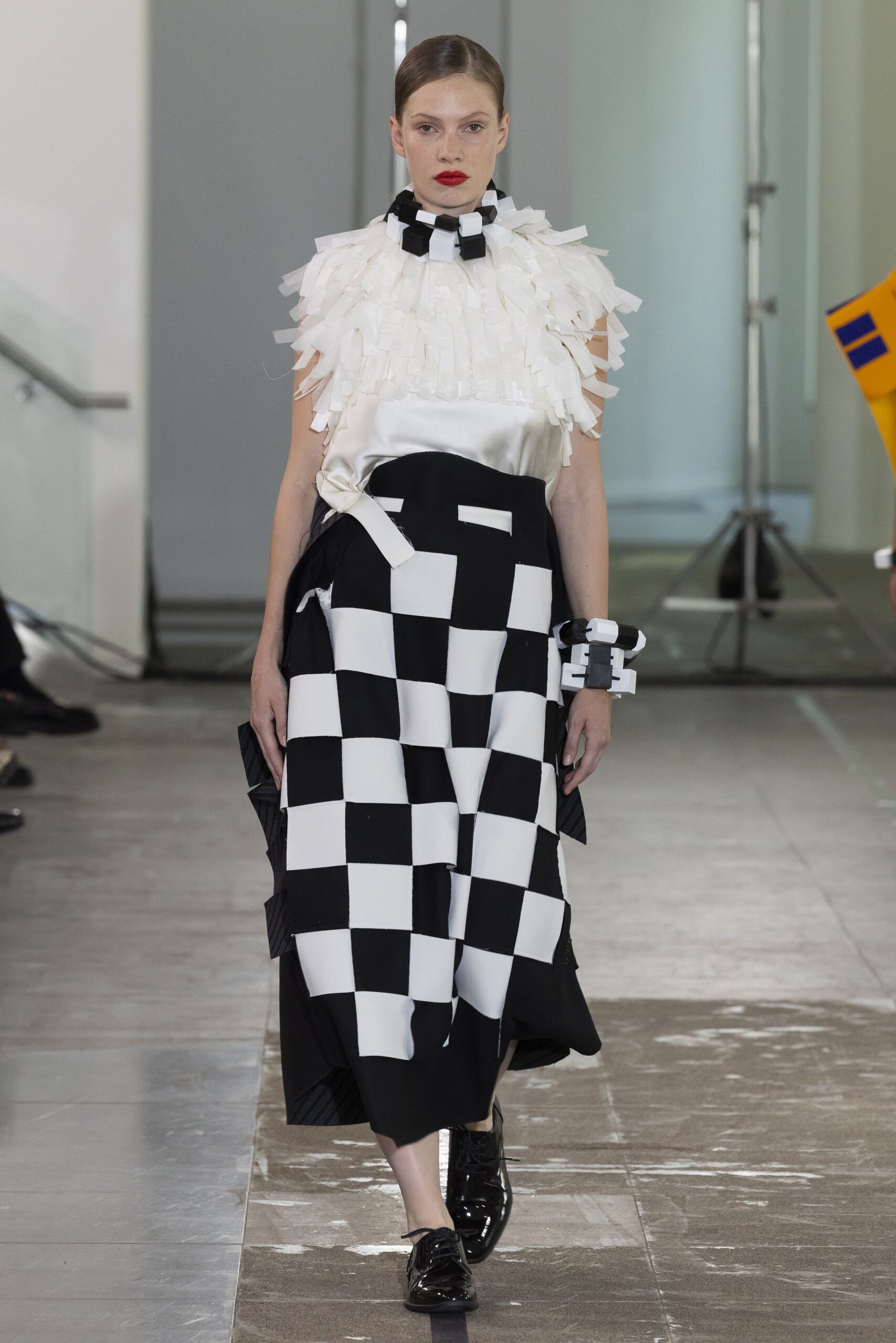 white ruffled top with checkered skirt