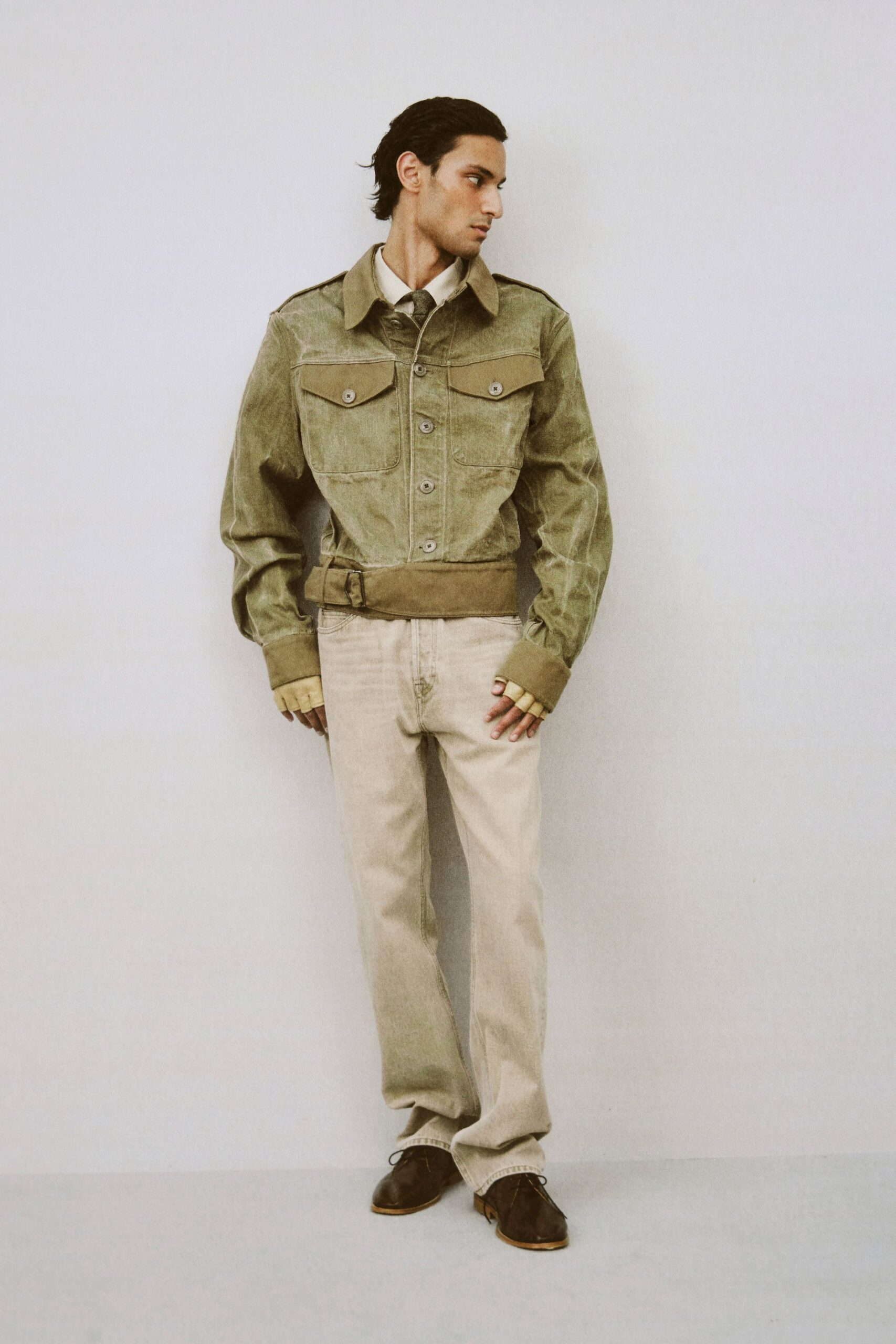 green cotton fitted jacket with beige pants
