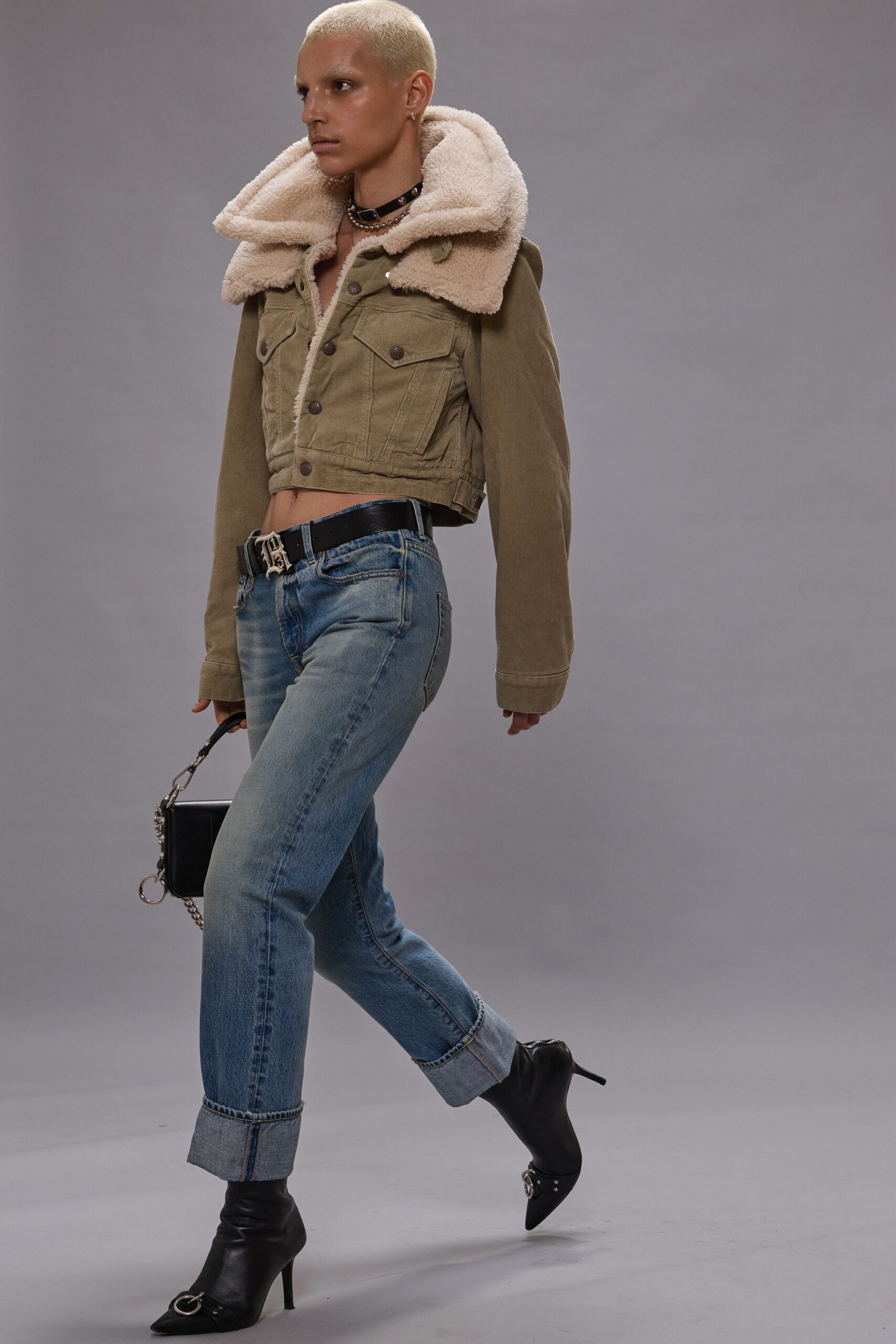 beige green fitted jacket with jeans