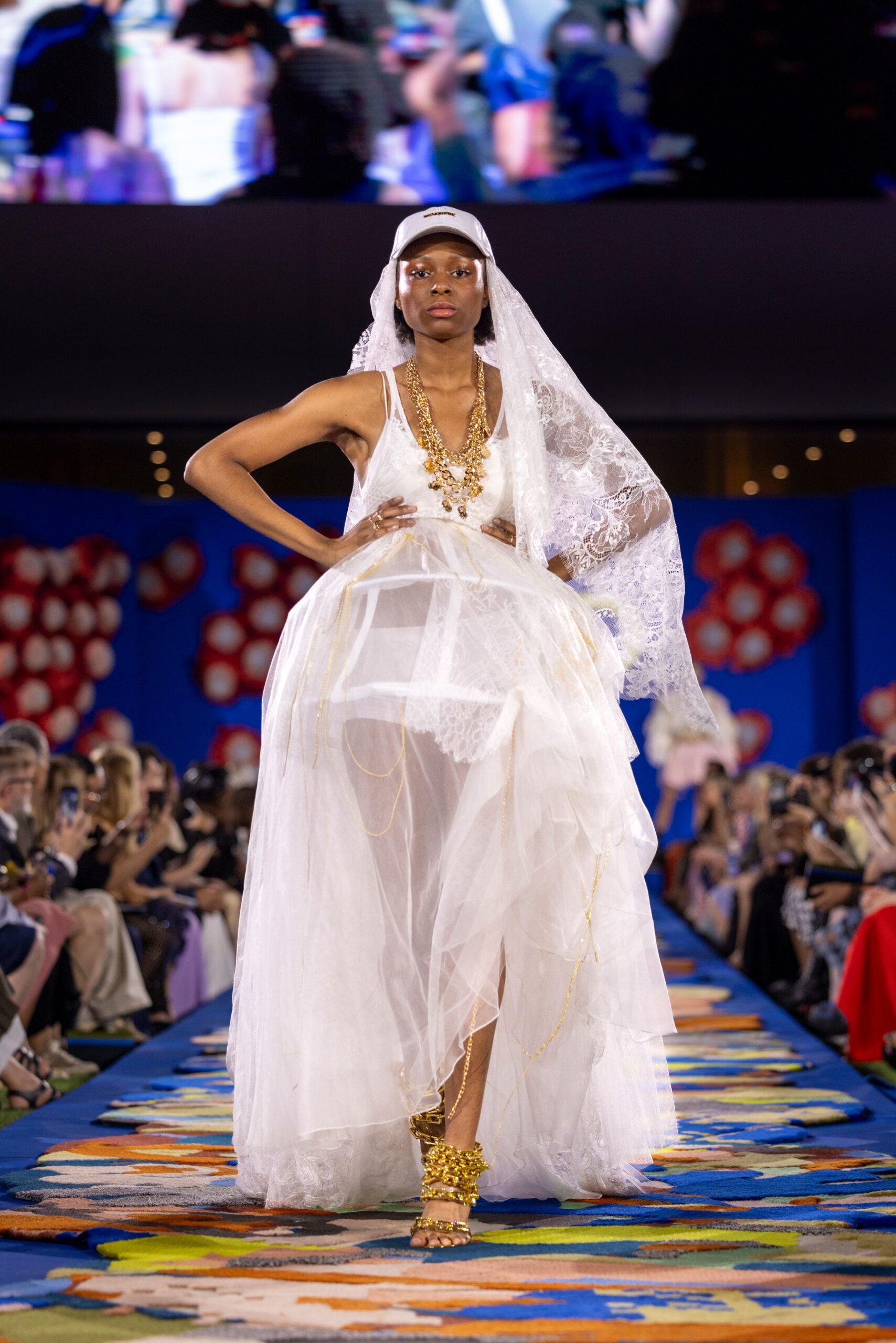 white lace maxi gown with gold shoes
