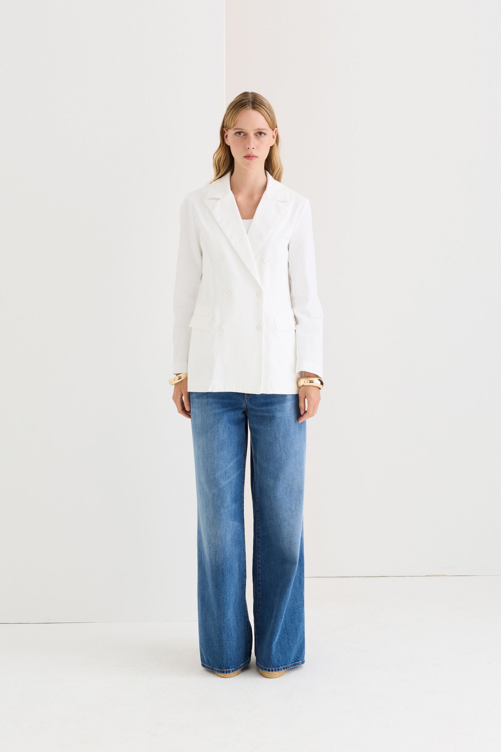 white cotton long-sleeve collared structured buttoned blazer