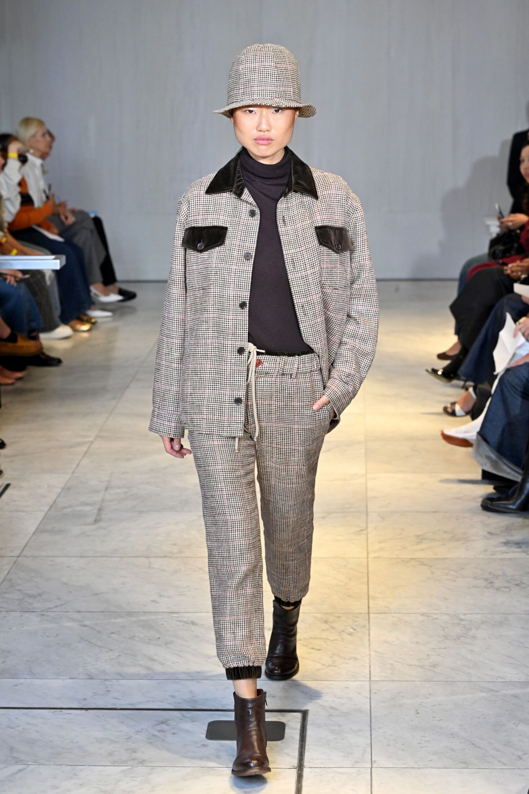 checked brown jacket with black top