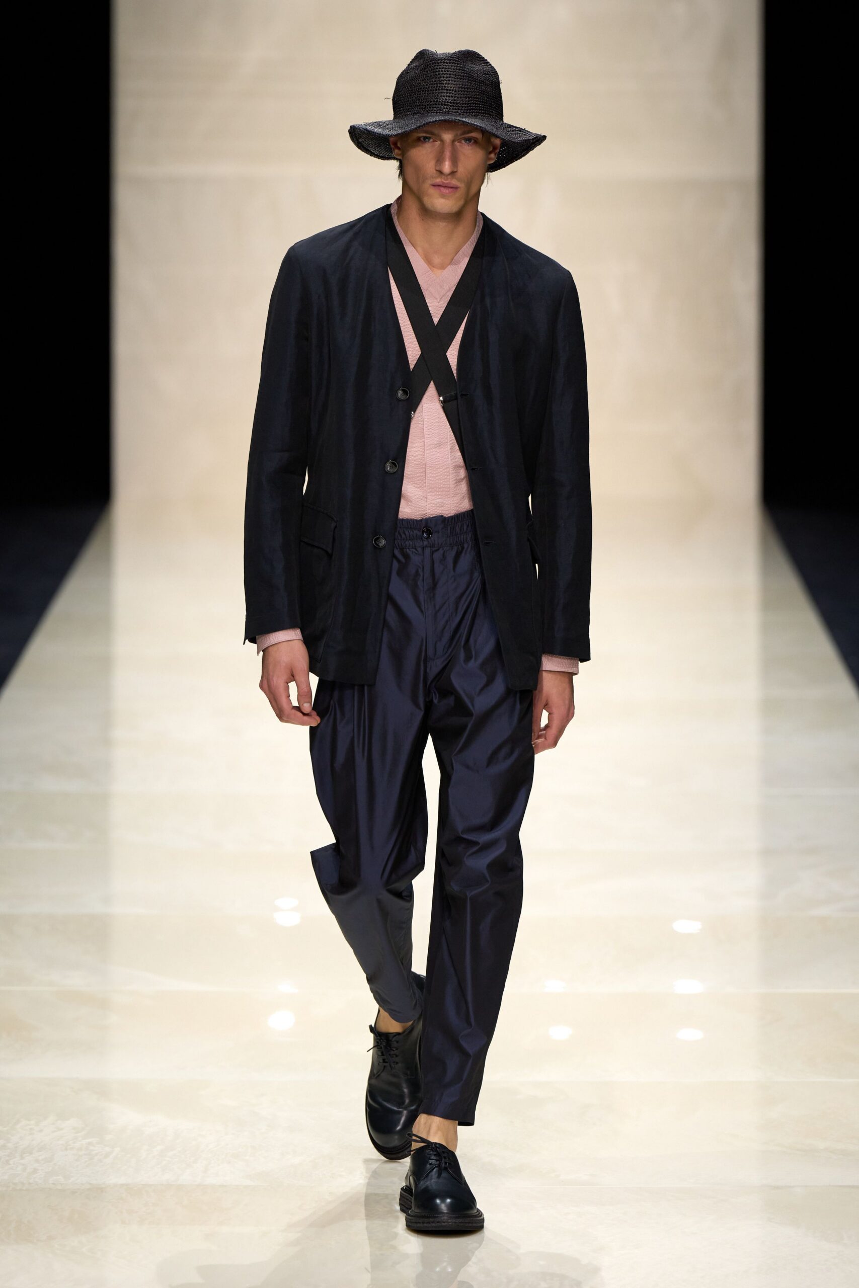 black jacket pink shirt navy pants