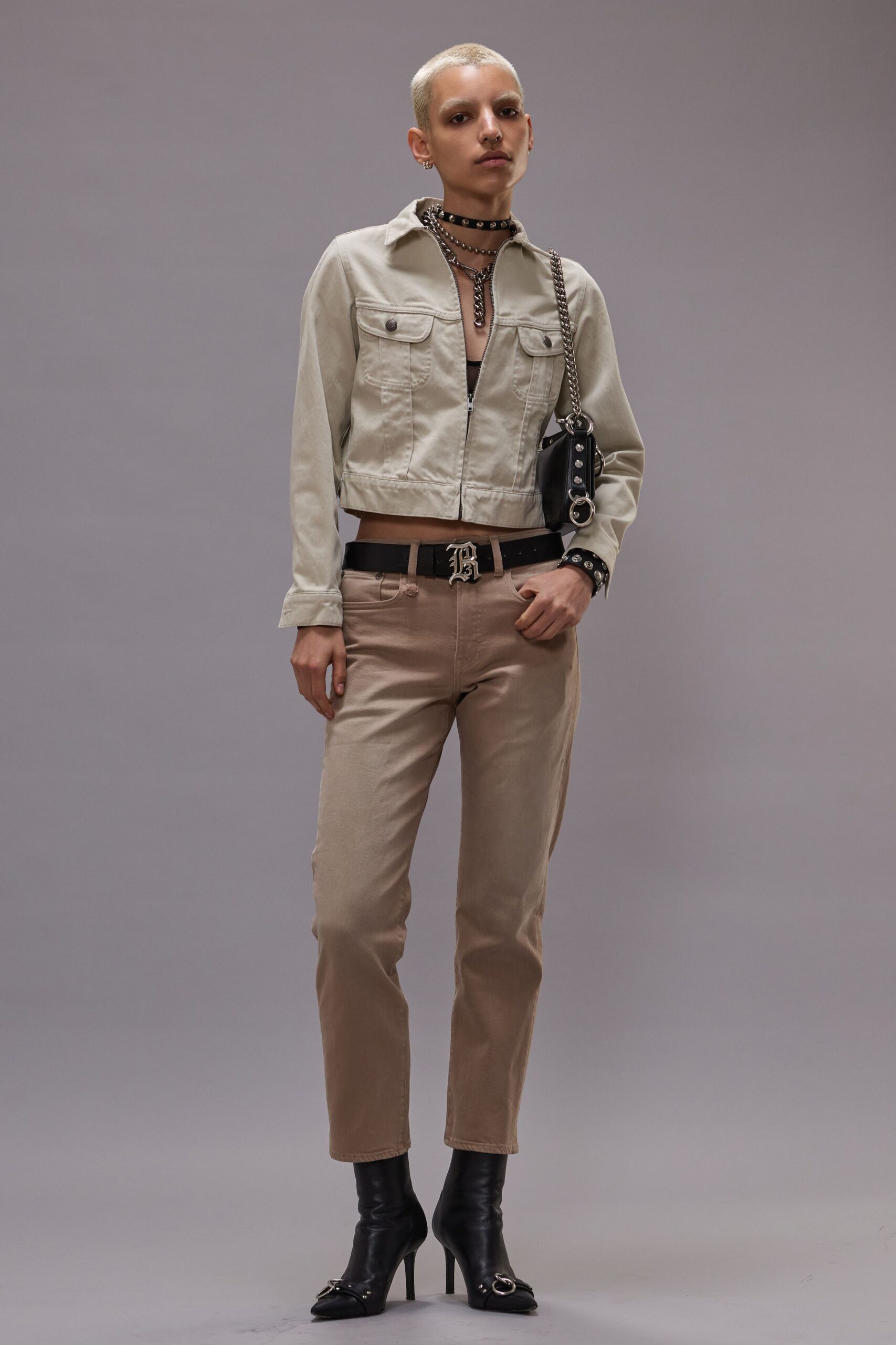 beige jacket brown pants black shoes