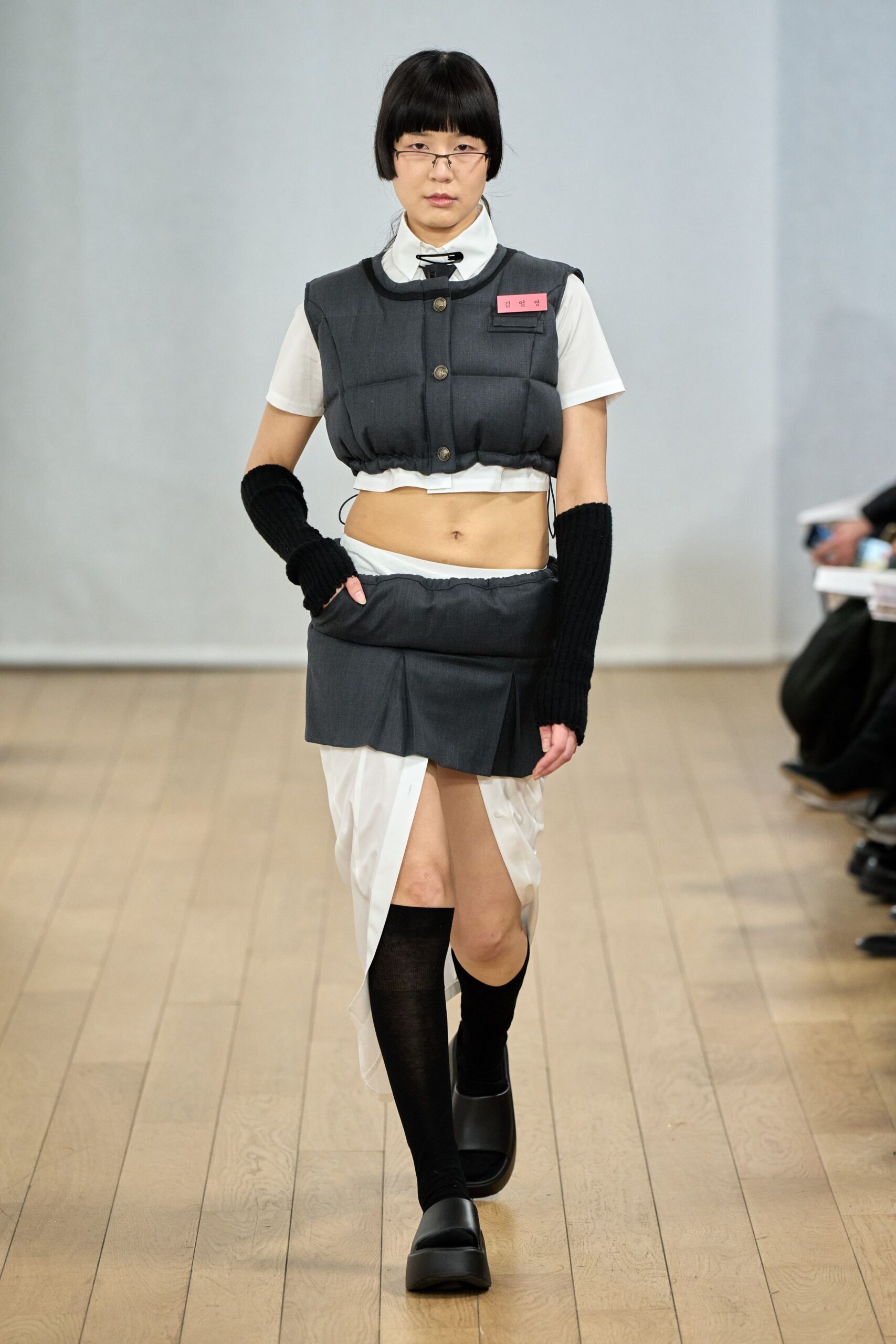 gray vest white shirt gray skirt