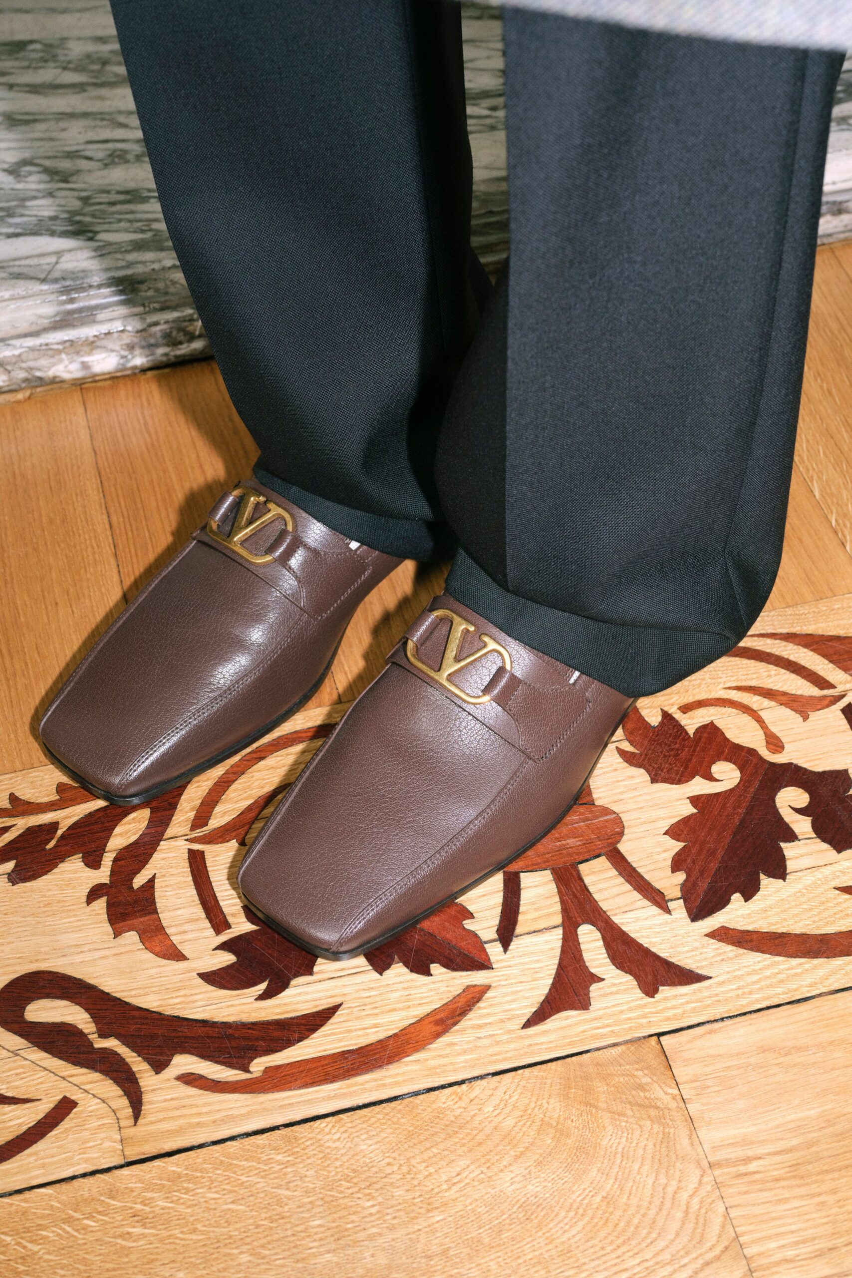 black tailored pants and brown shoes