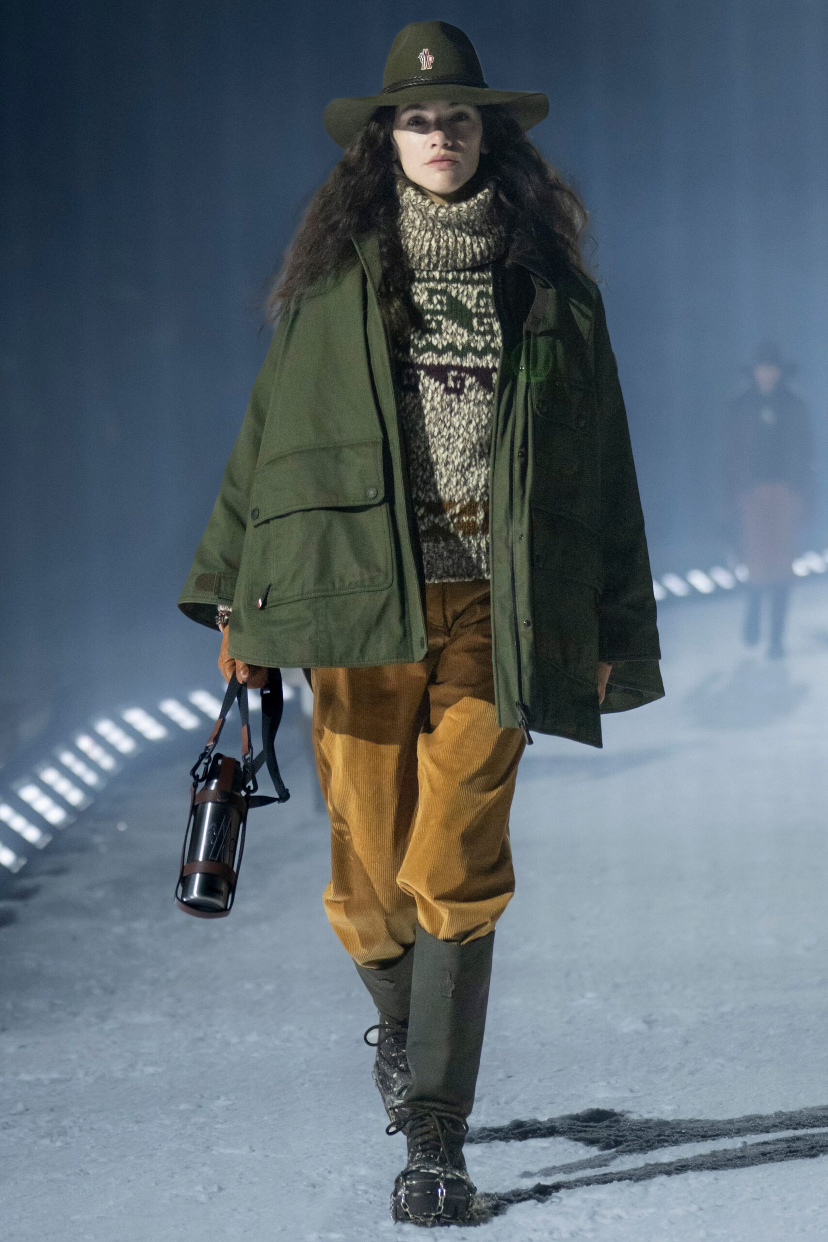 green jacket beige sweater orange pants