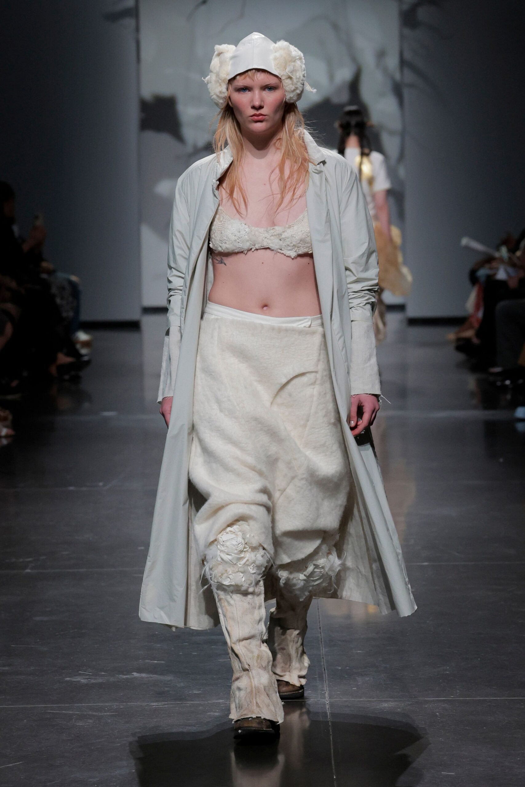 white coat beige top white skirt