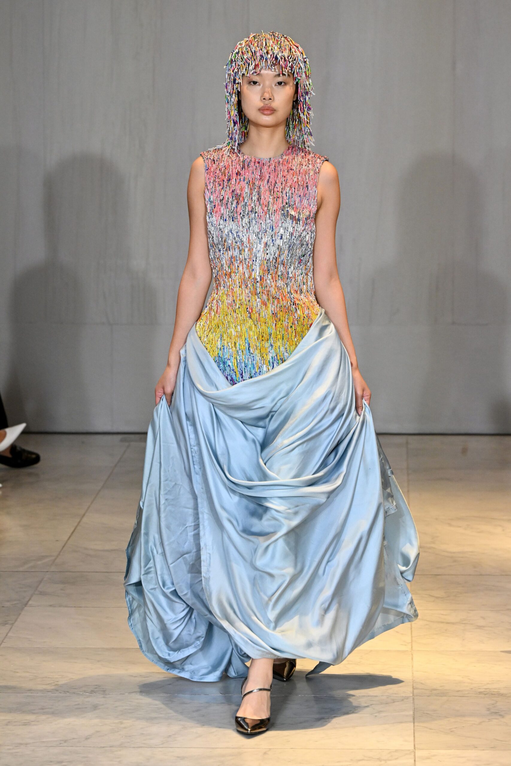 blue silk sleeveless fitted pleated layered flowing gown