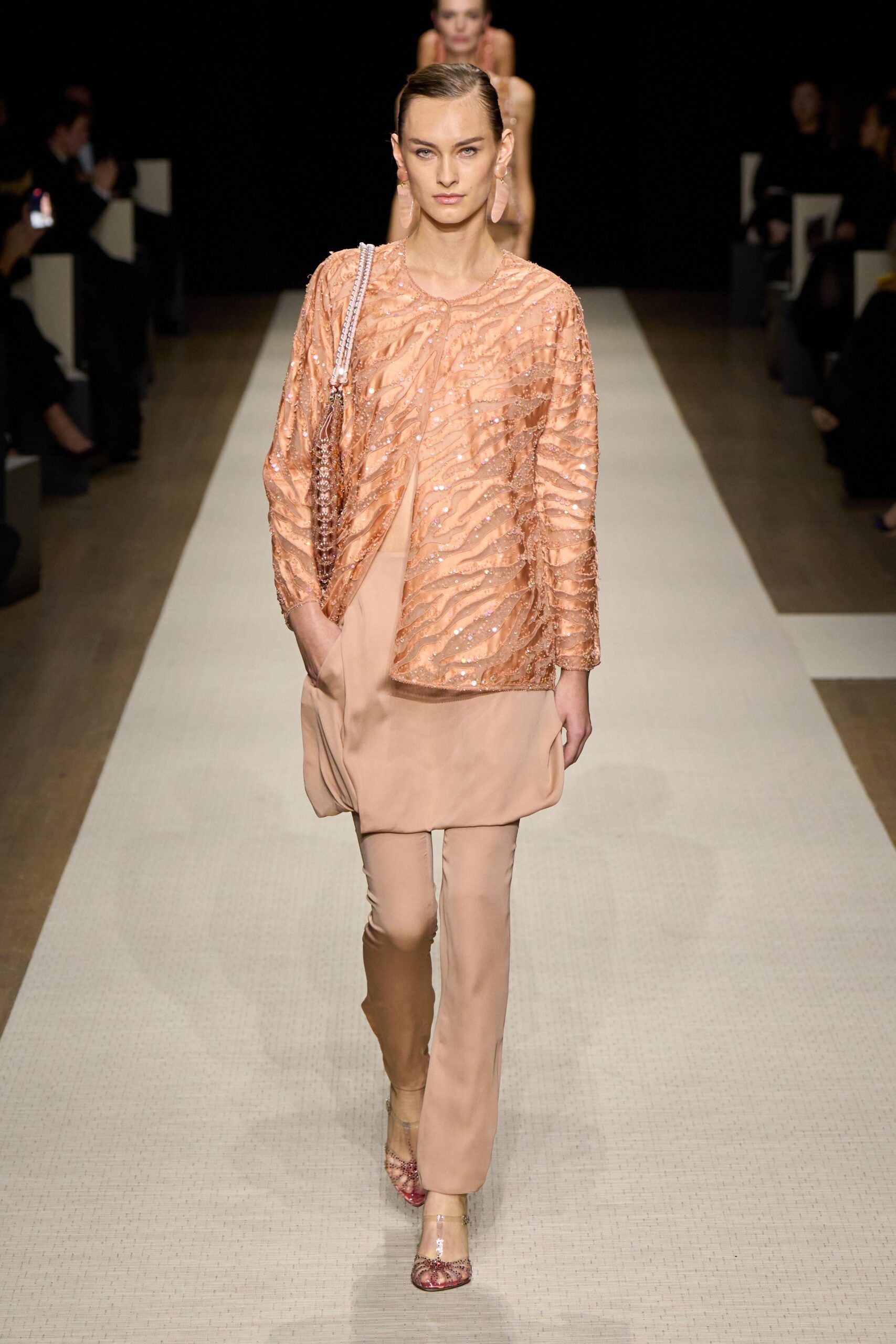 peach sequined top with beige pants
