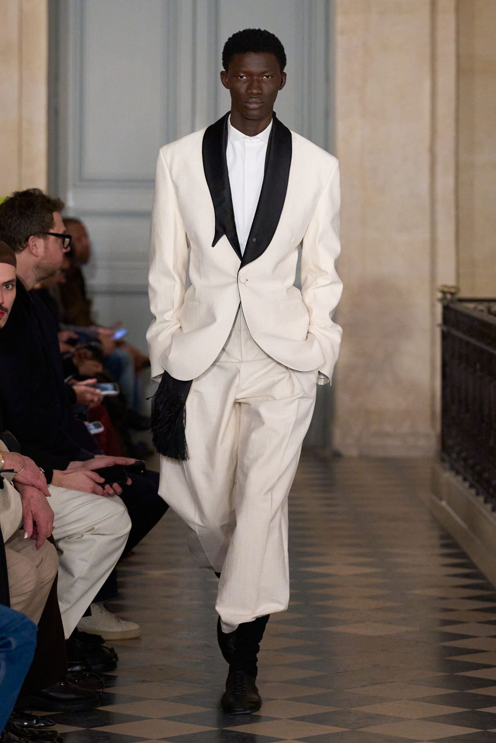 white tailored suit with black shoes