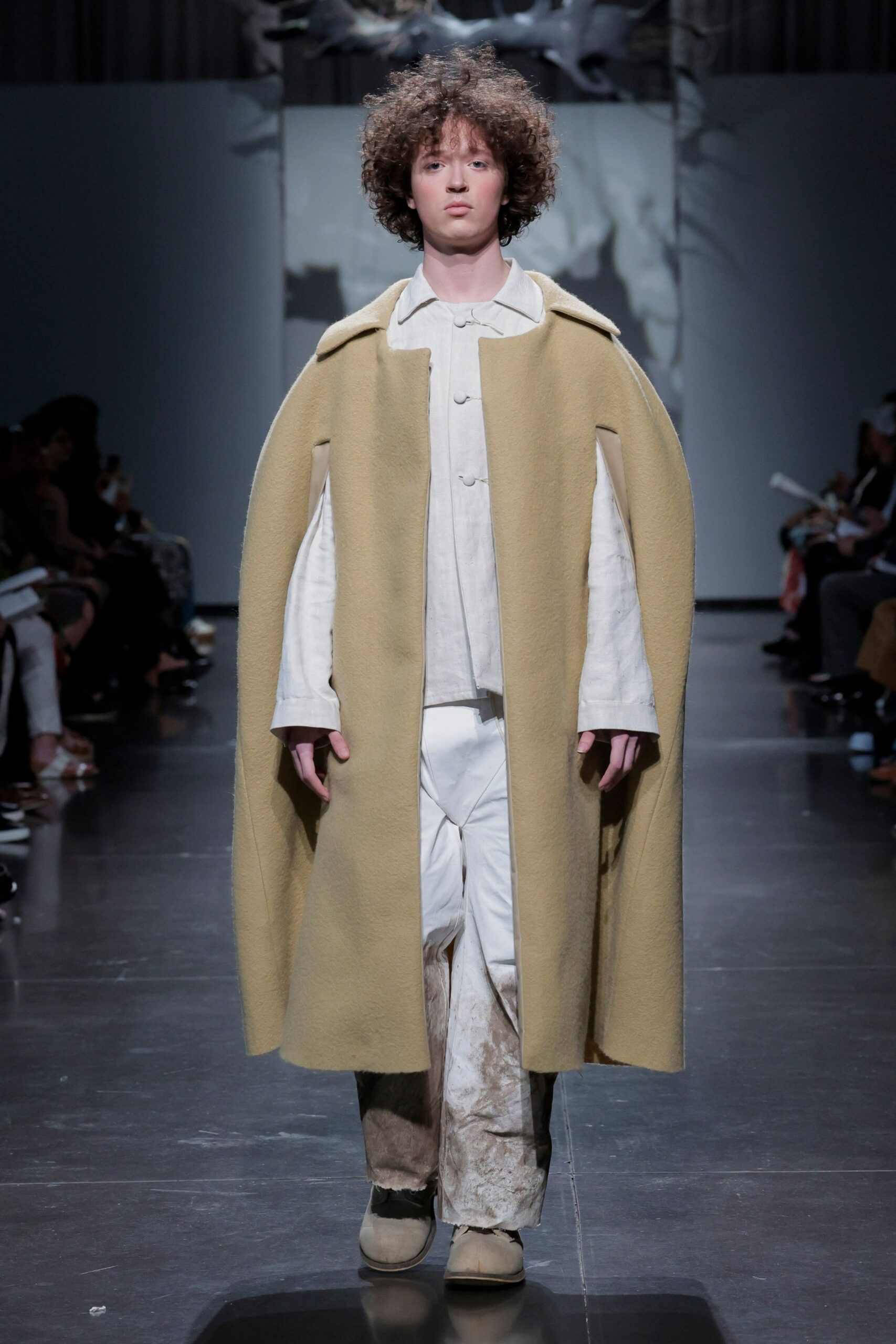 yellow wool cape with white shirt and pants