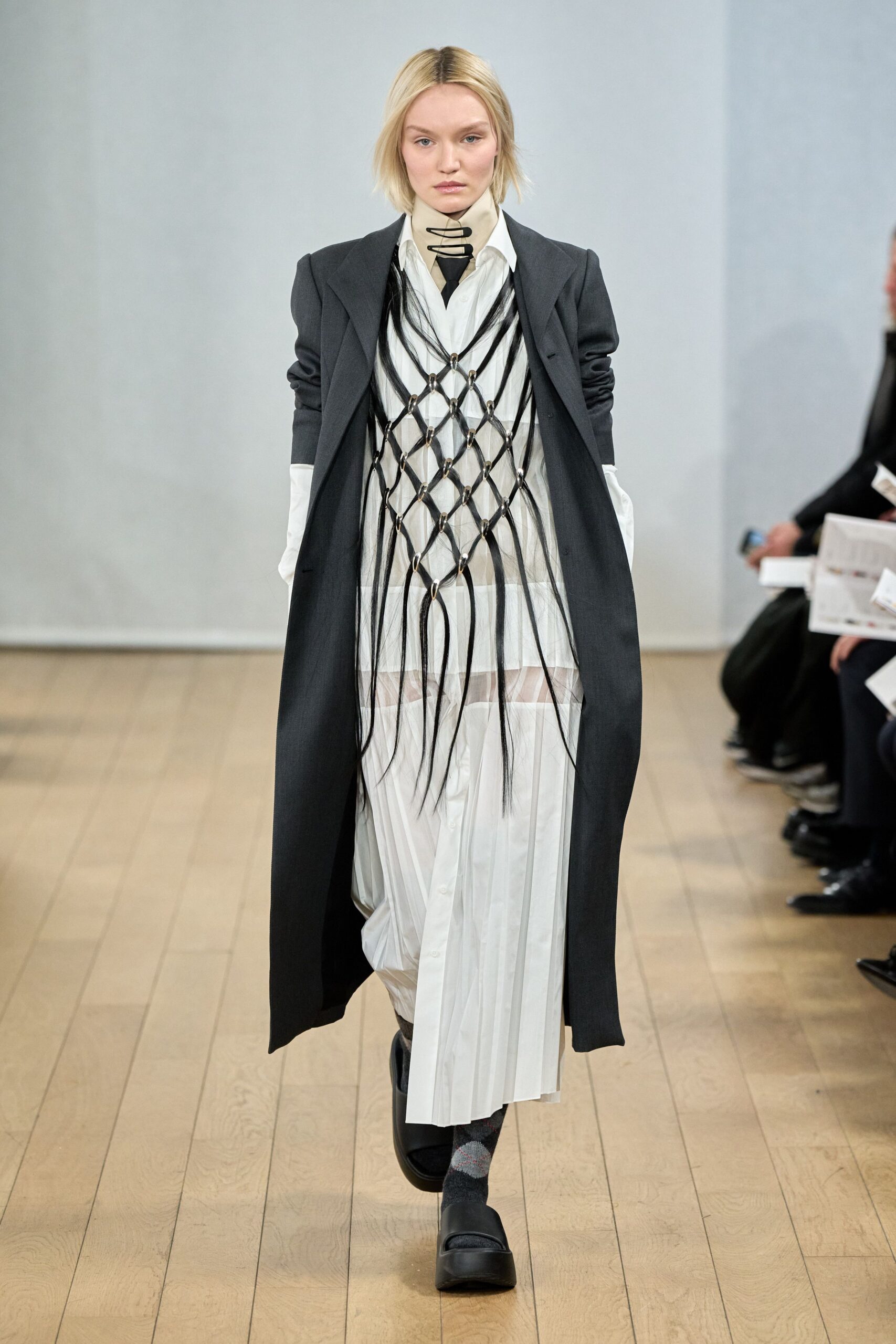 black tailored coat with white dress