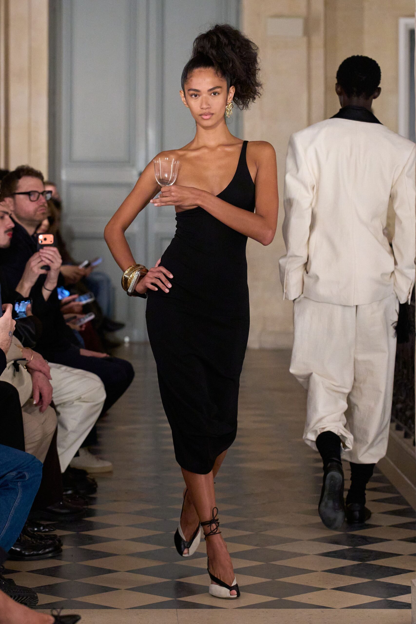 black fitted midi dress with strappy shoes