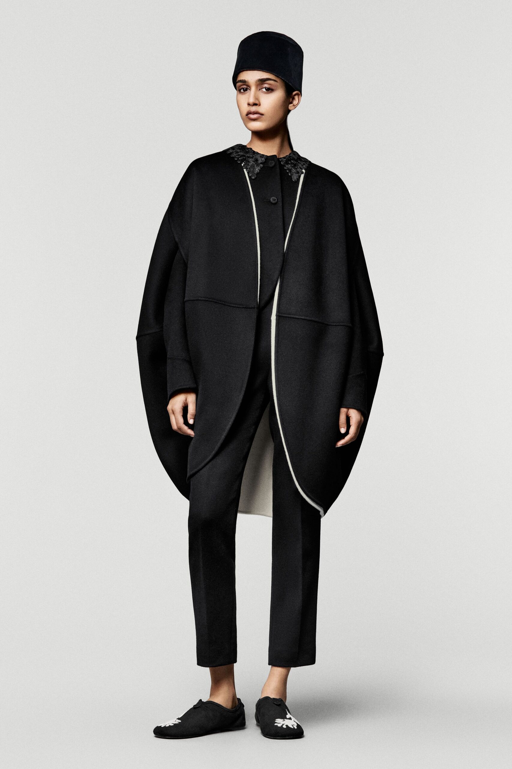 black wool long-sleeve collared oversized layered coat
