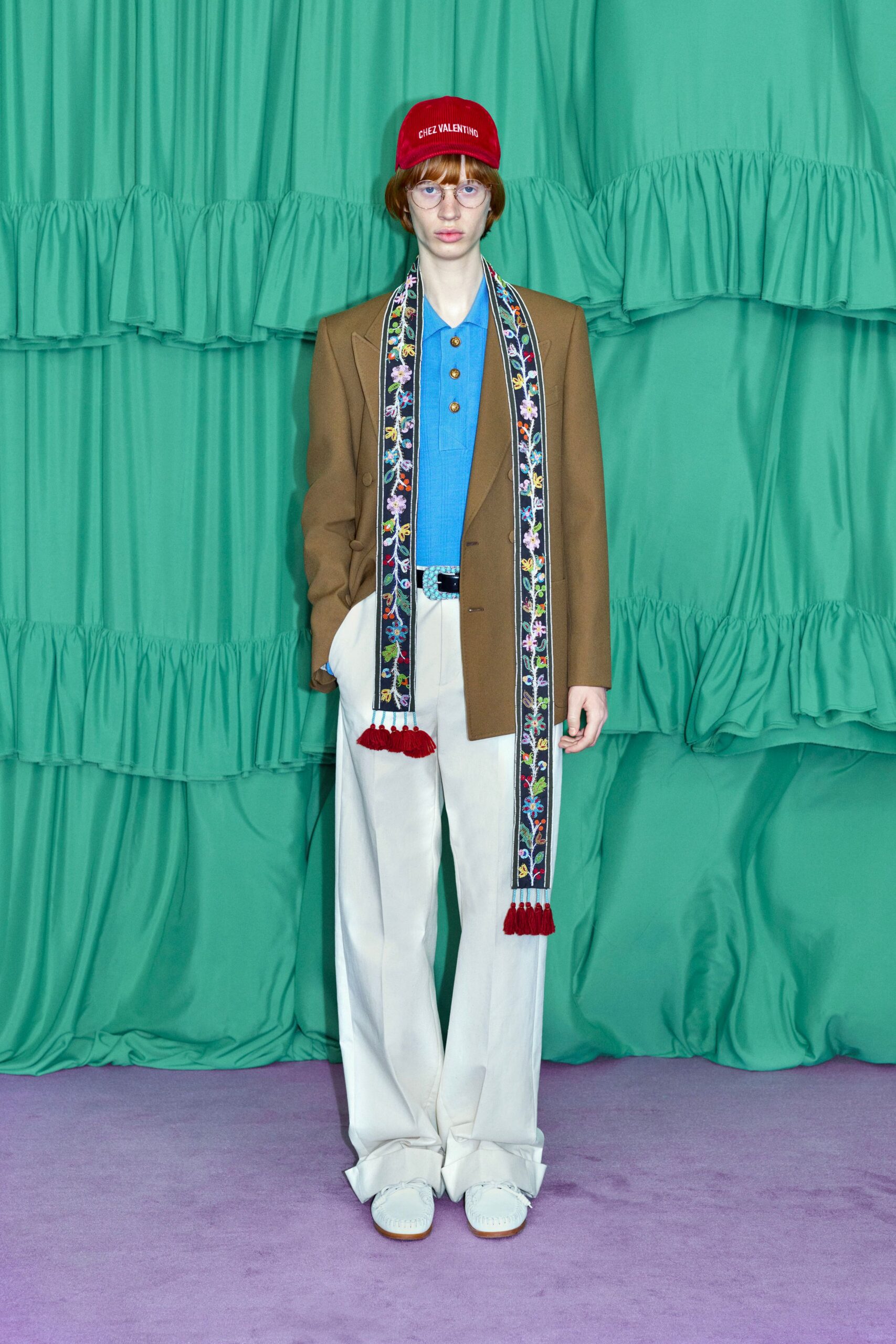brown blazer blue shirt white pants