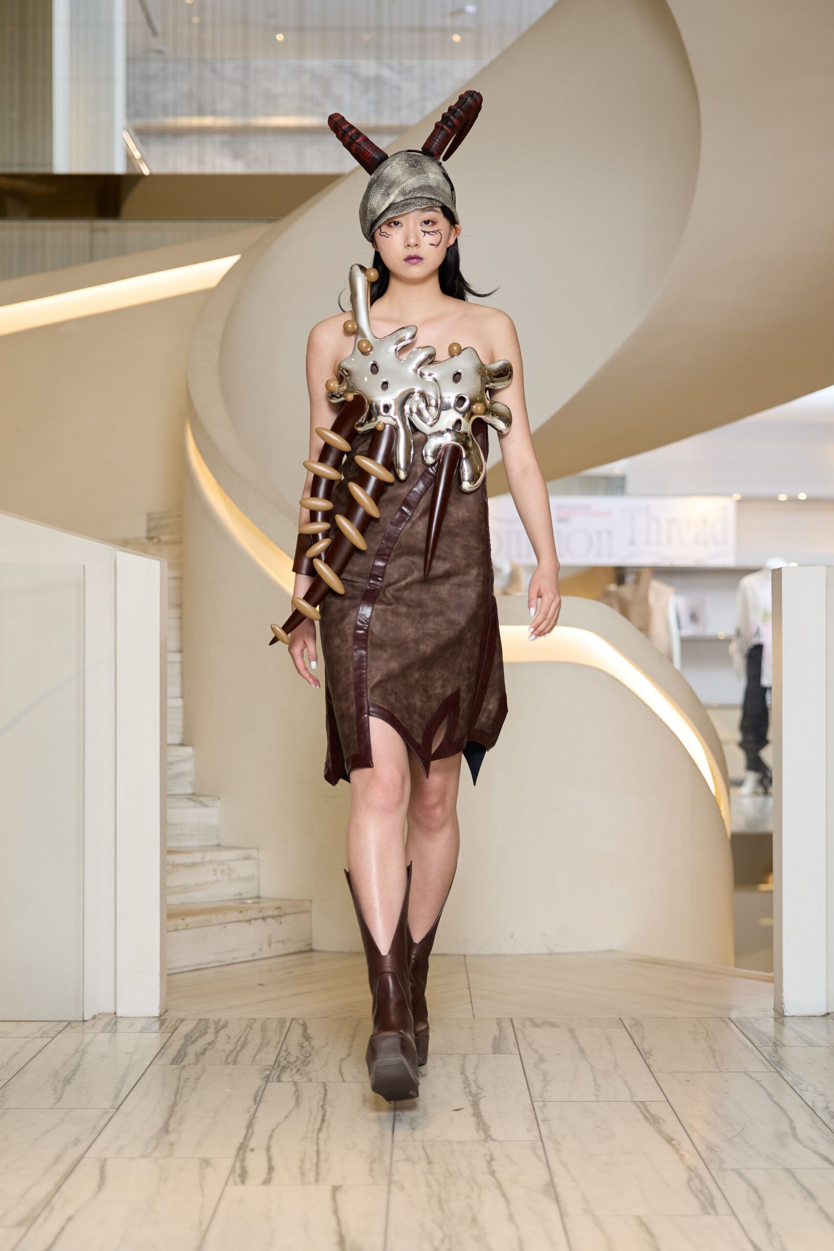 brown leather asymmetric dress with boots