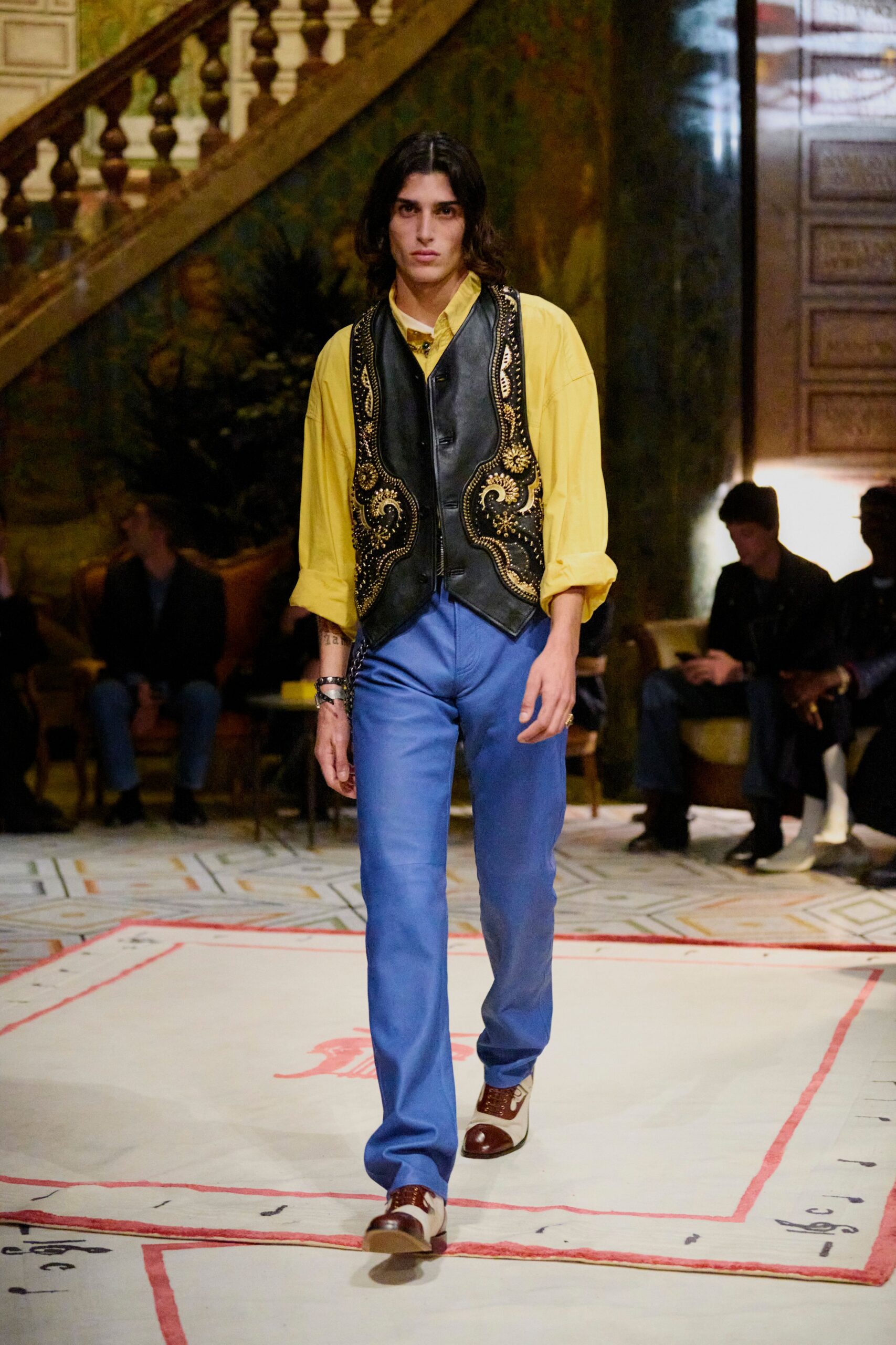 black leather embroidered vest with yellow shirt